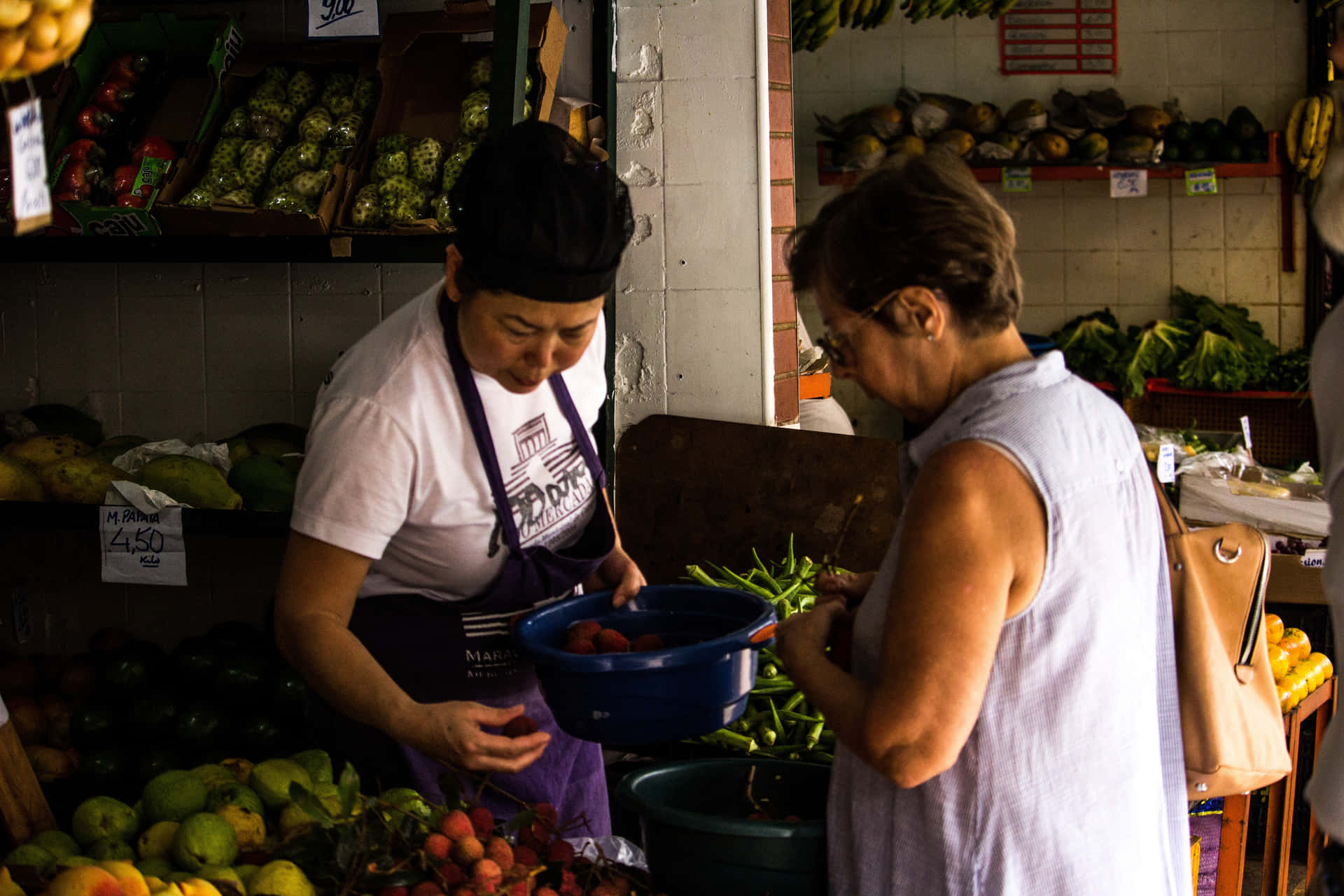 Two Women Standing In A Market