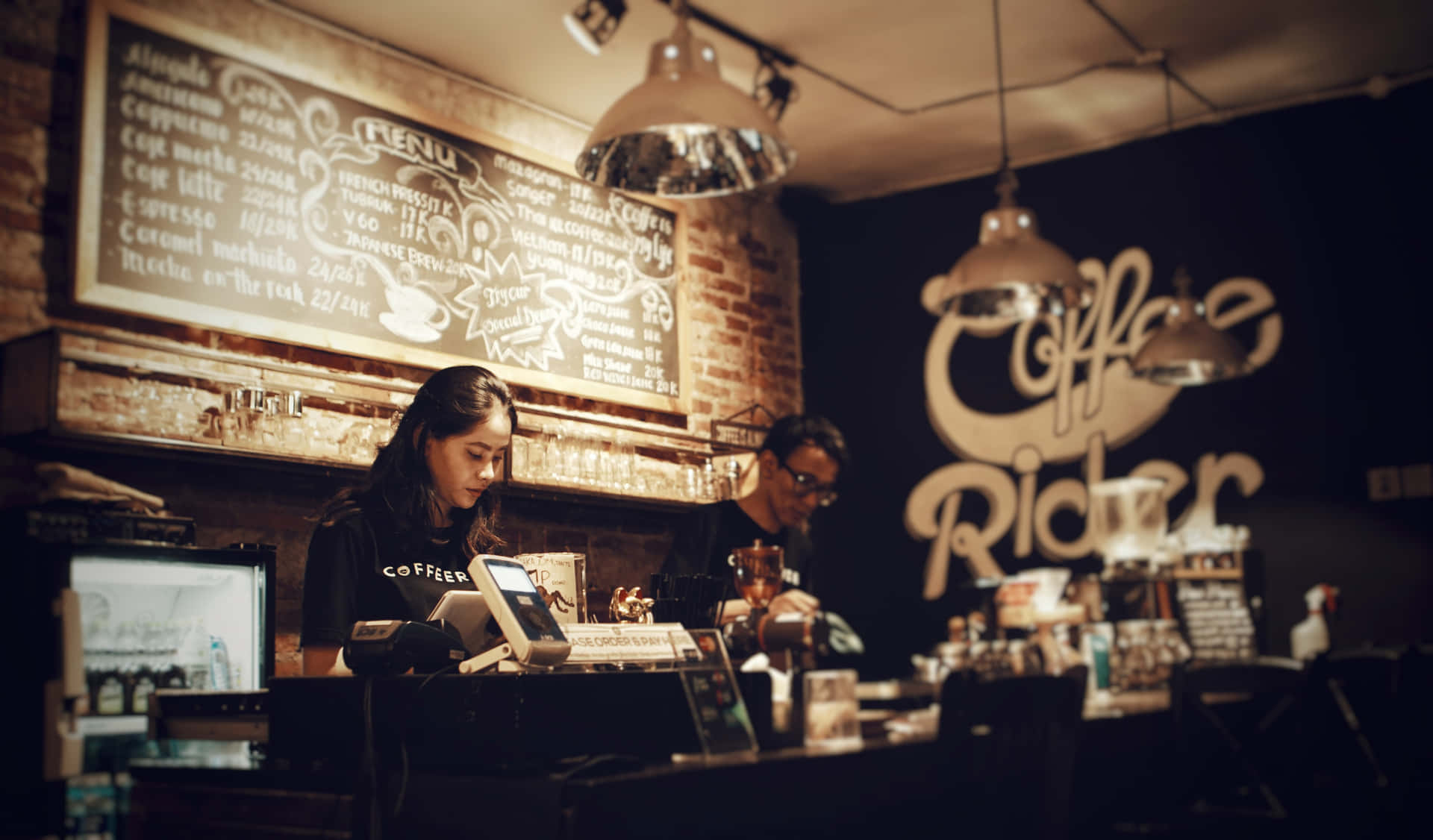 Two People Working At A Coffee Shop