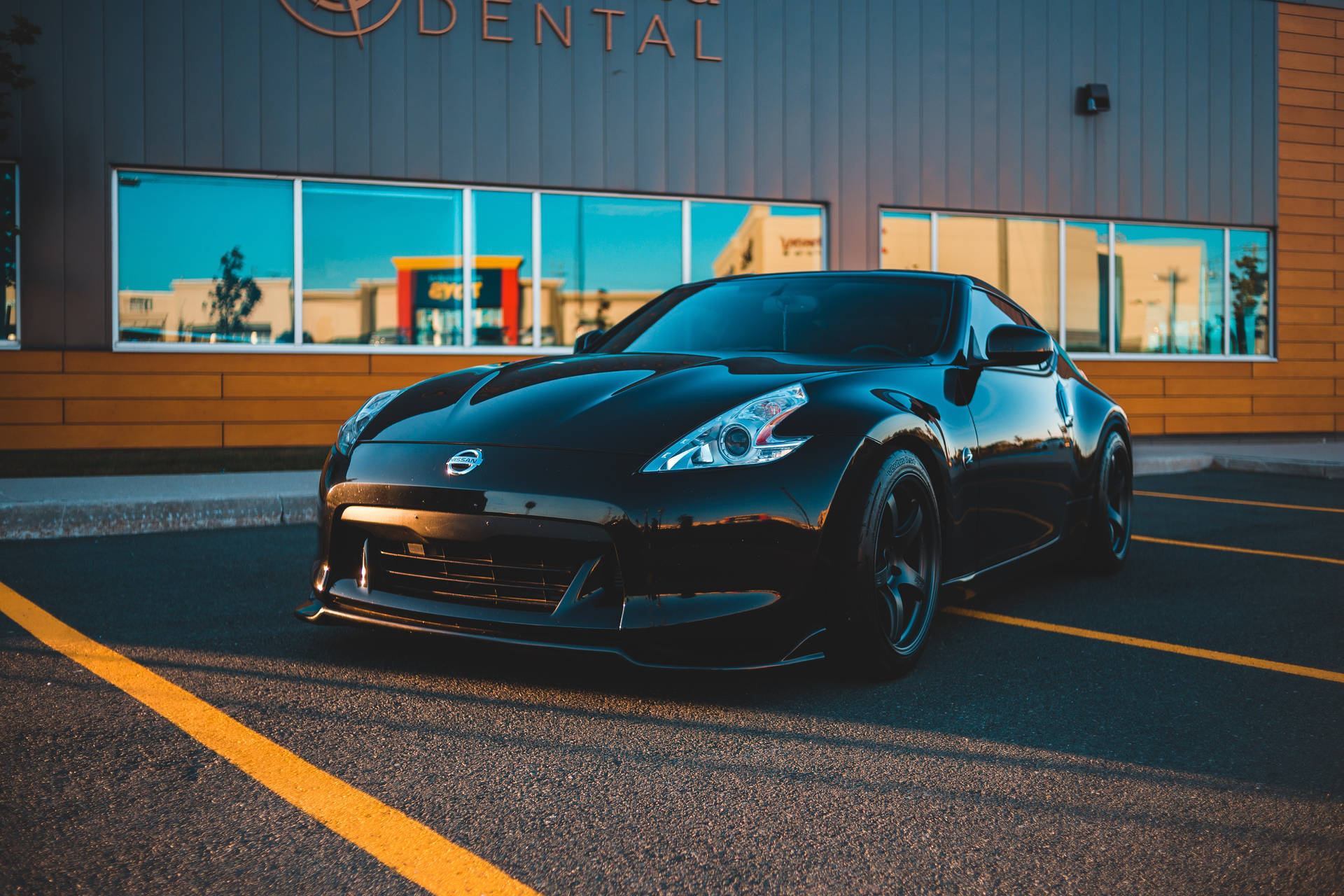 Storefront With Black Sports Cars Wallpaper