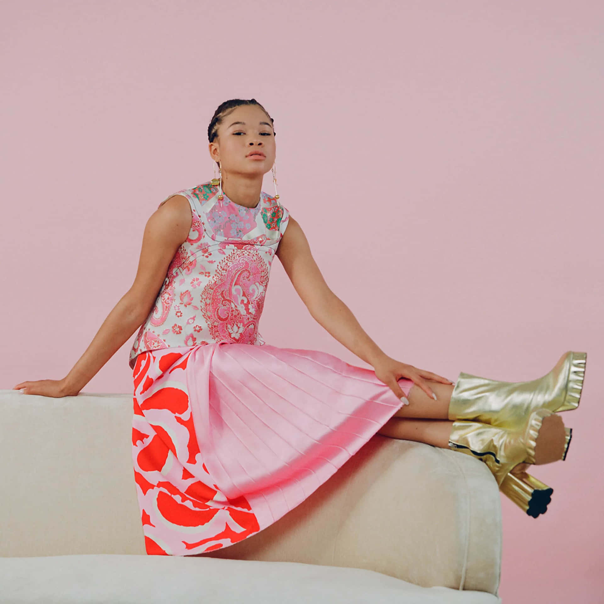 Storm Reid Elegant Pose Pink Backdrop Wallpaper