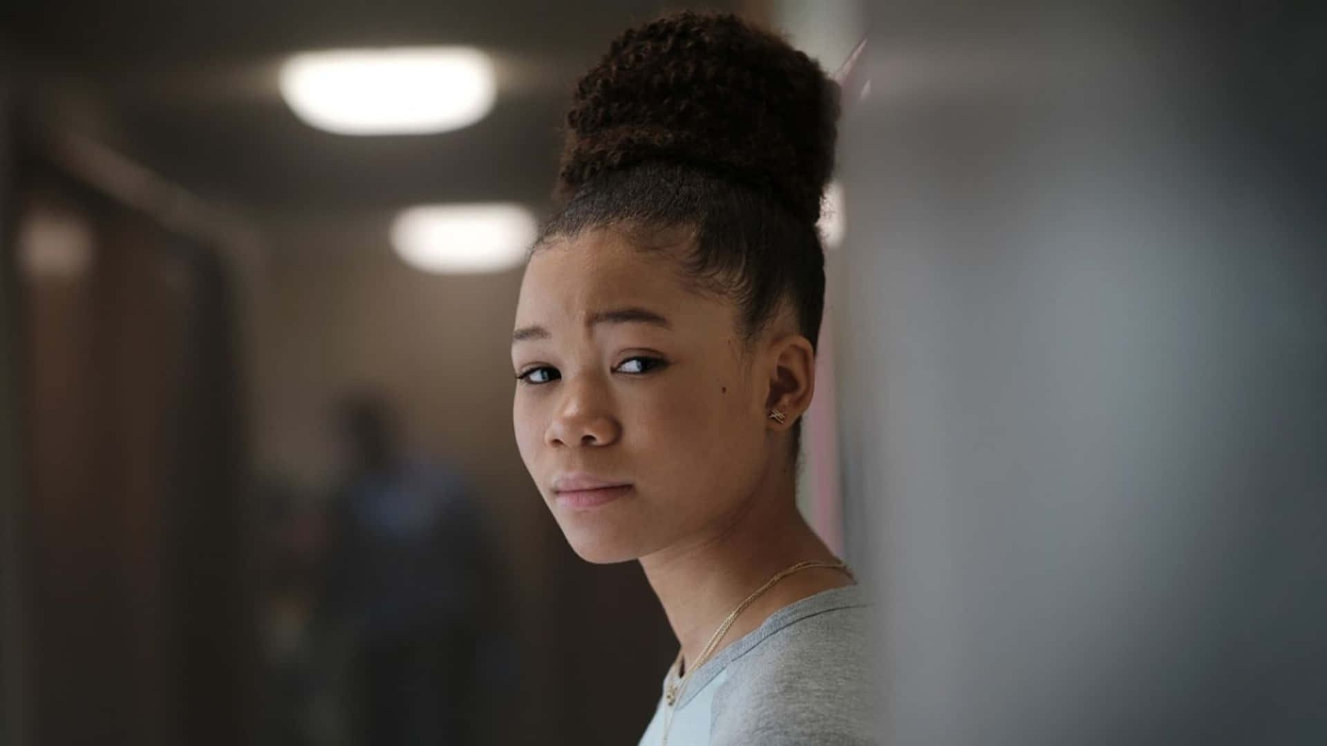 Storm Reid Glance Hallway Scene Wallpaper