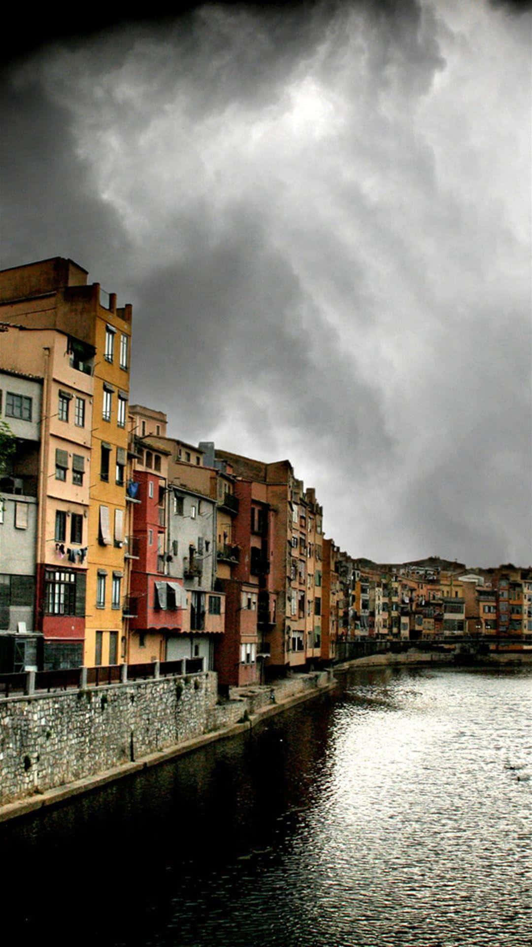 Stormy_ Spanish_ Riverside_ Townscape Wallpaper