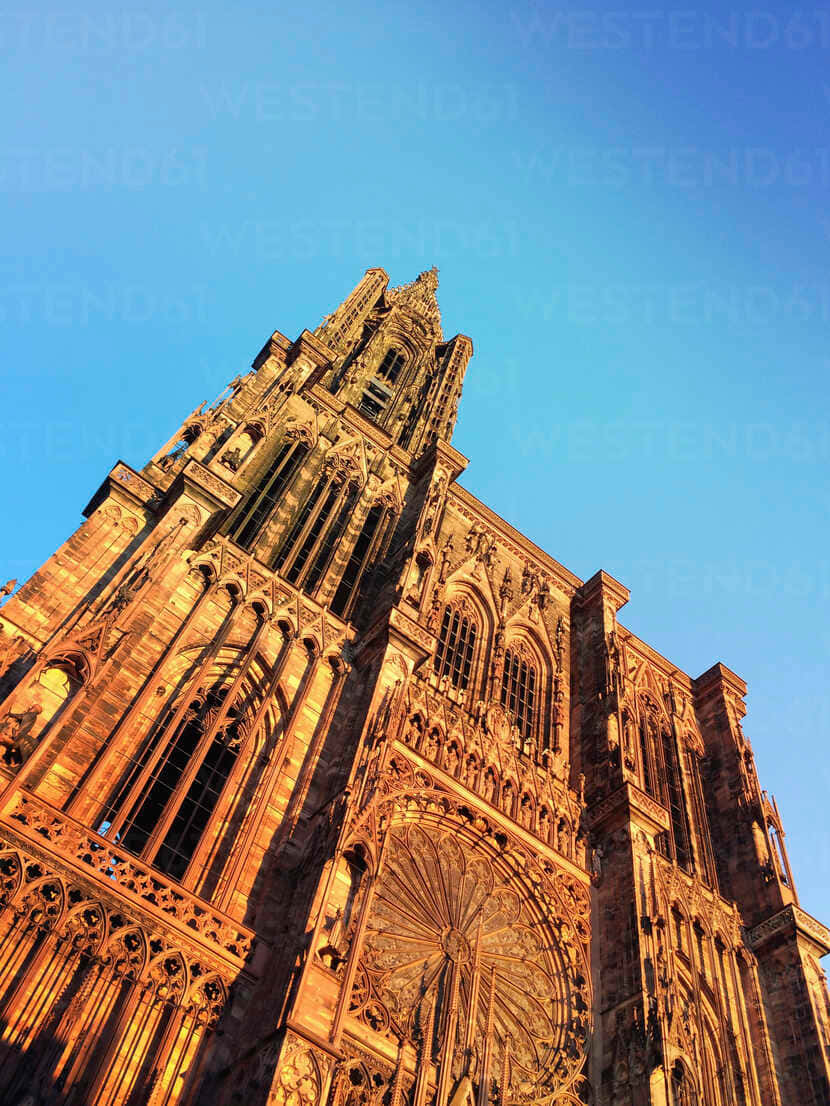 Strasbourg Cathedral's Majestic Presence In Strasbourg, France Wallpaper