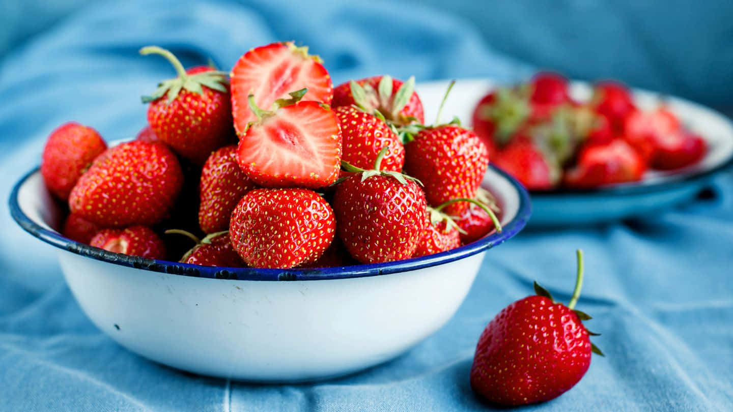 Bowl And Plate Of Strawberries Background In Blue Aesthetic Background