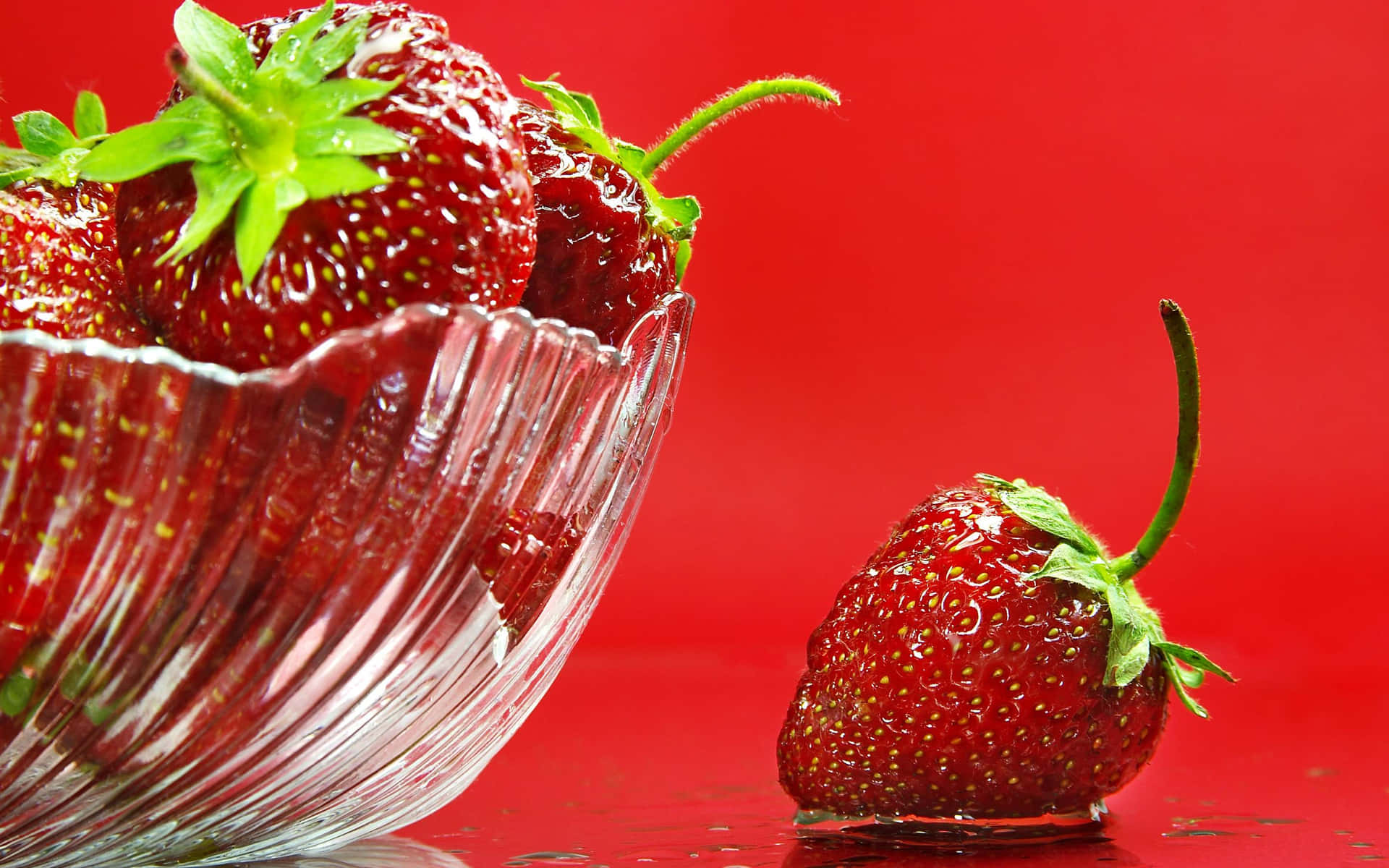 Sweet and juicy strawberries enjoy their delicious life on a scenic background.