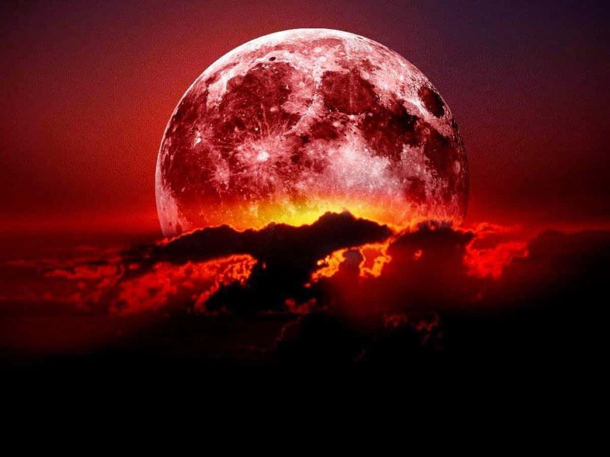 Mesmerizing Strawberry Moon illuminating the night sky Wallpaper