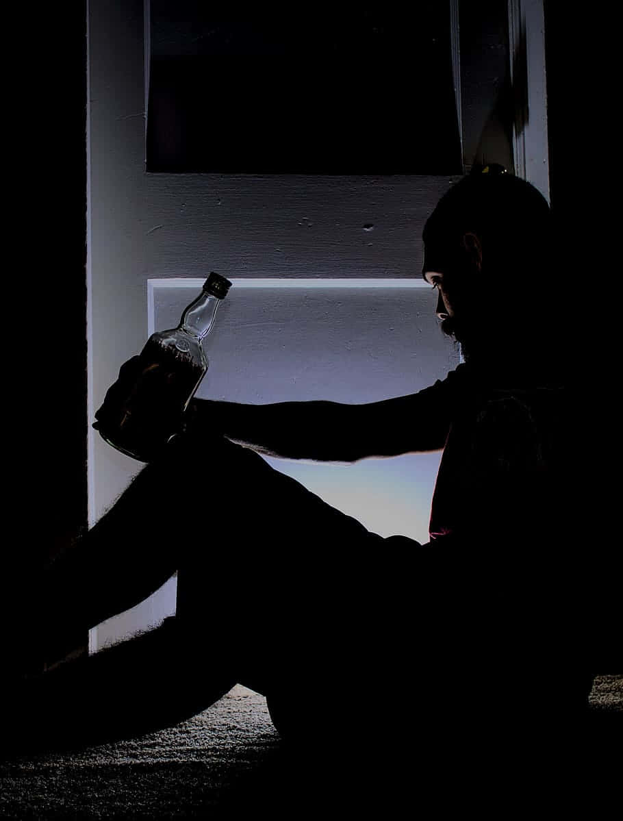 Stress Man Drinking Alcohol Wallpaper