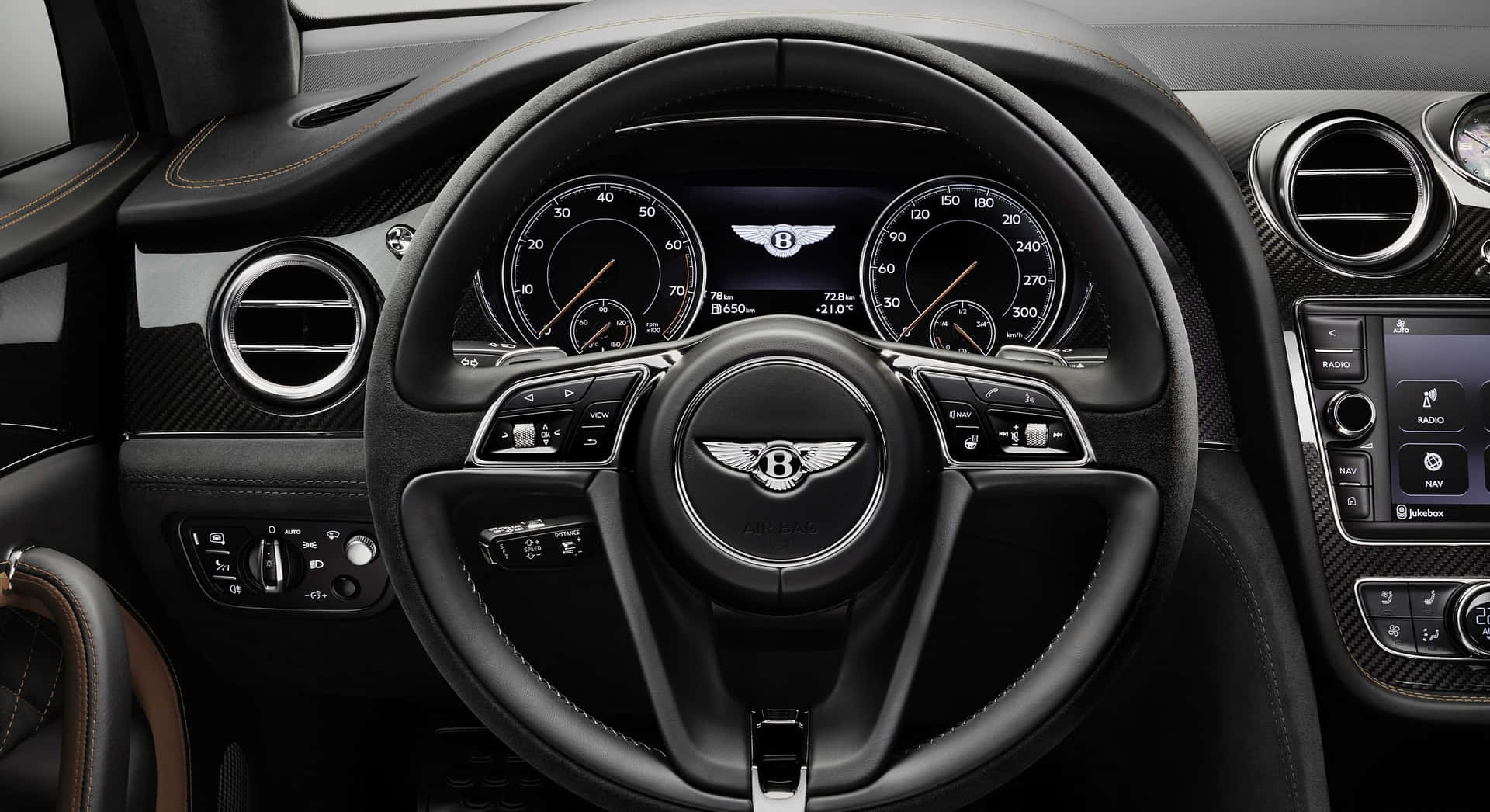 Striking Close-up View Of A Modern Steering Wheel Wallpaper