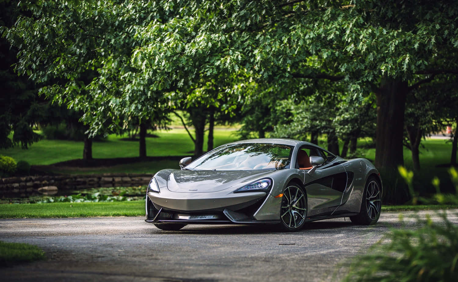 Striking Design Of Mclaren 570s On Open Road Wallpaper