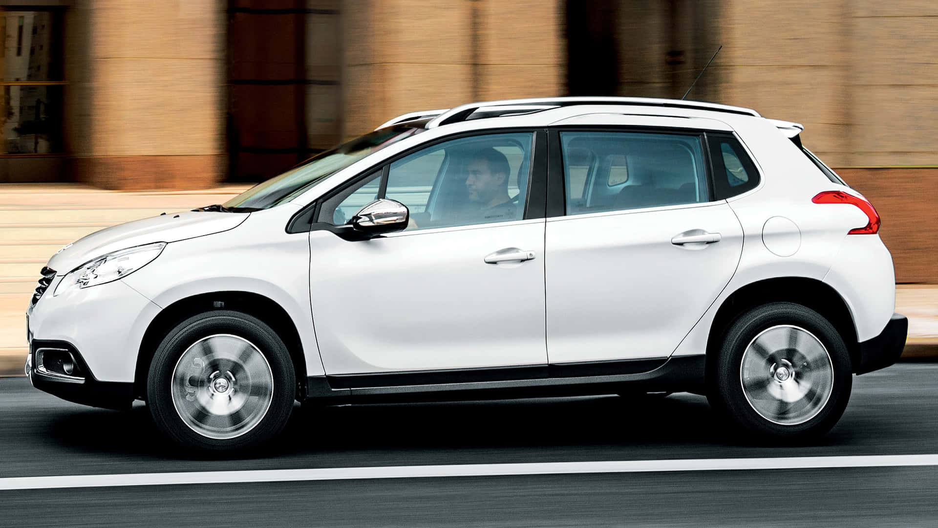 Striking Elegance Of Peugeot 2008 Against A Sunset Backdrop Wallpaper