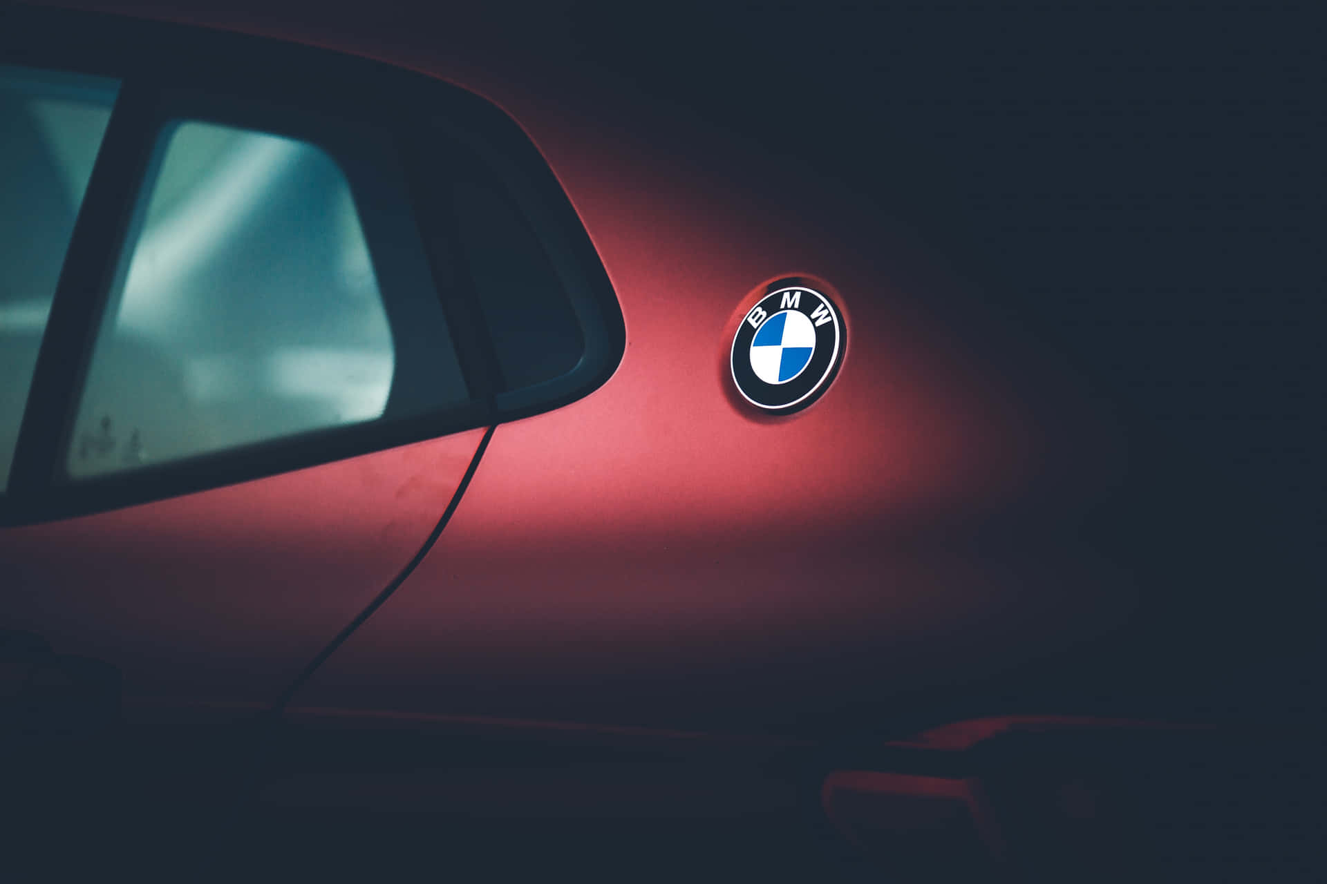 Striking Logo Of Bmw On A Dark Background Wallpaper