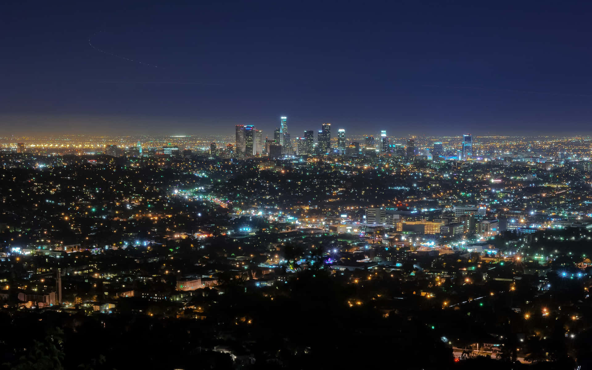 Striking Skyline Of Los Angeles Against A Deep Purple Sky