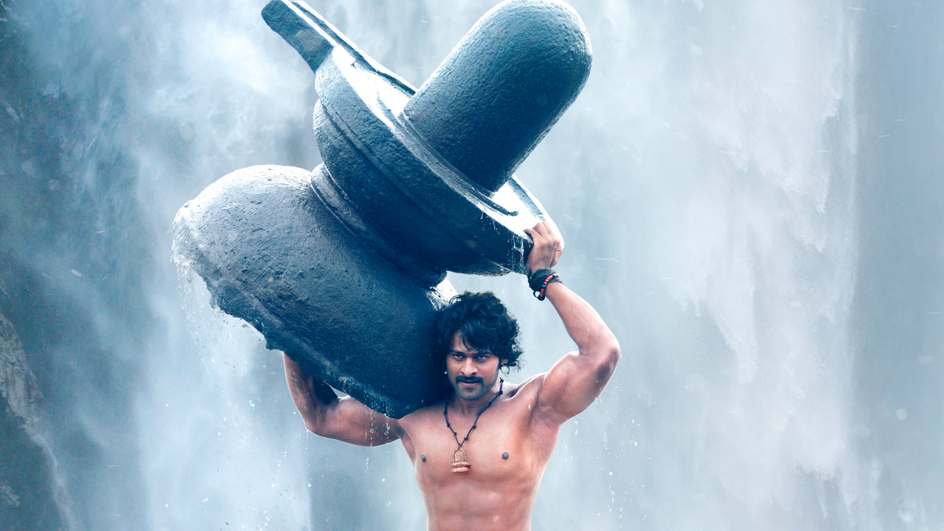 Strong Prabhas Carrying Stone Wallpaper