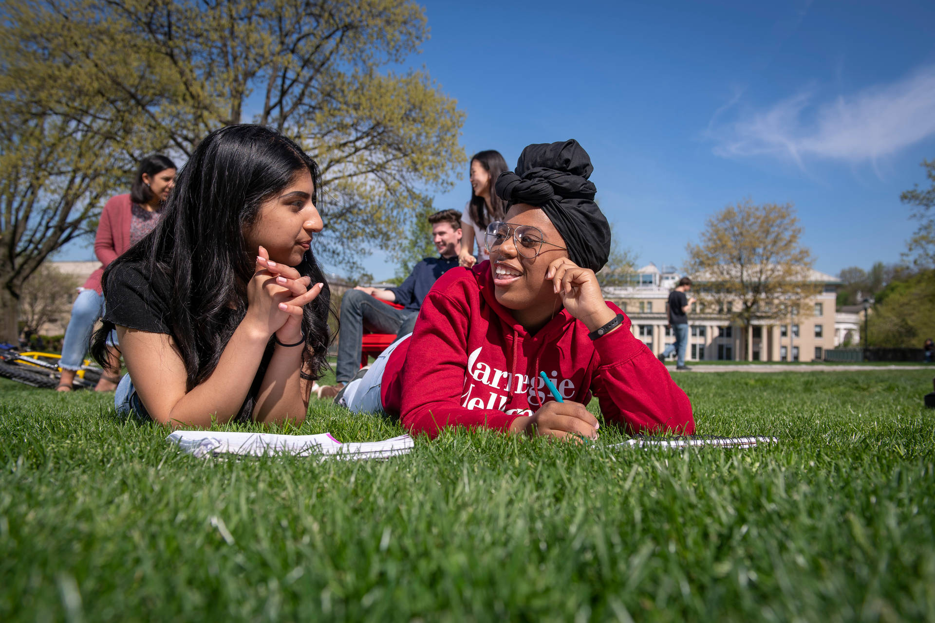 Students Lying On Grass Carnegie Mellon University Wallpaper