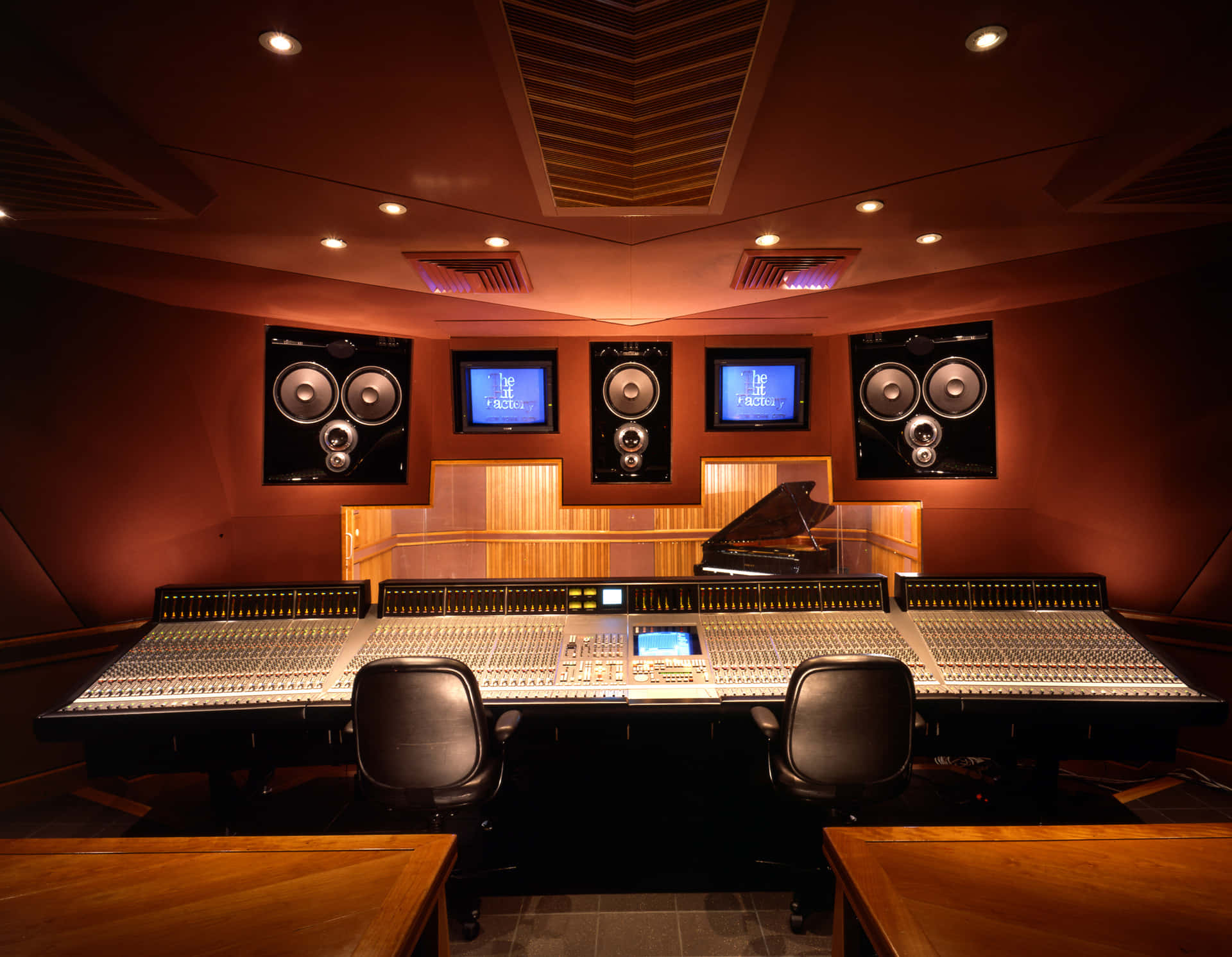 A Recording Studio With A Large Sound Board