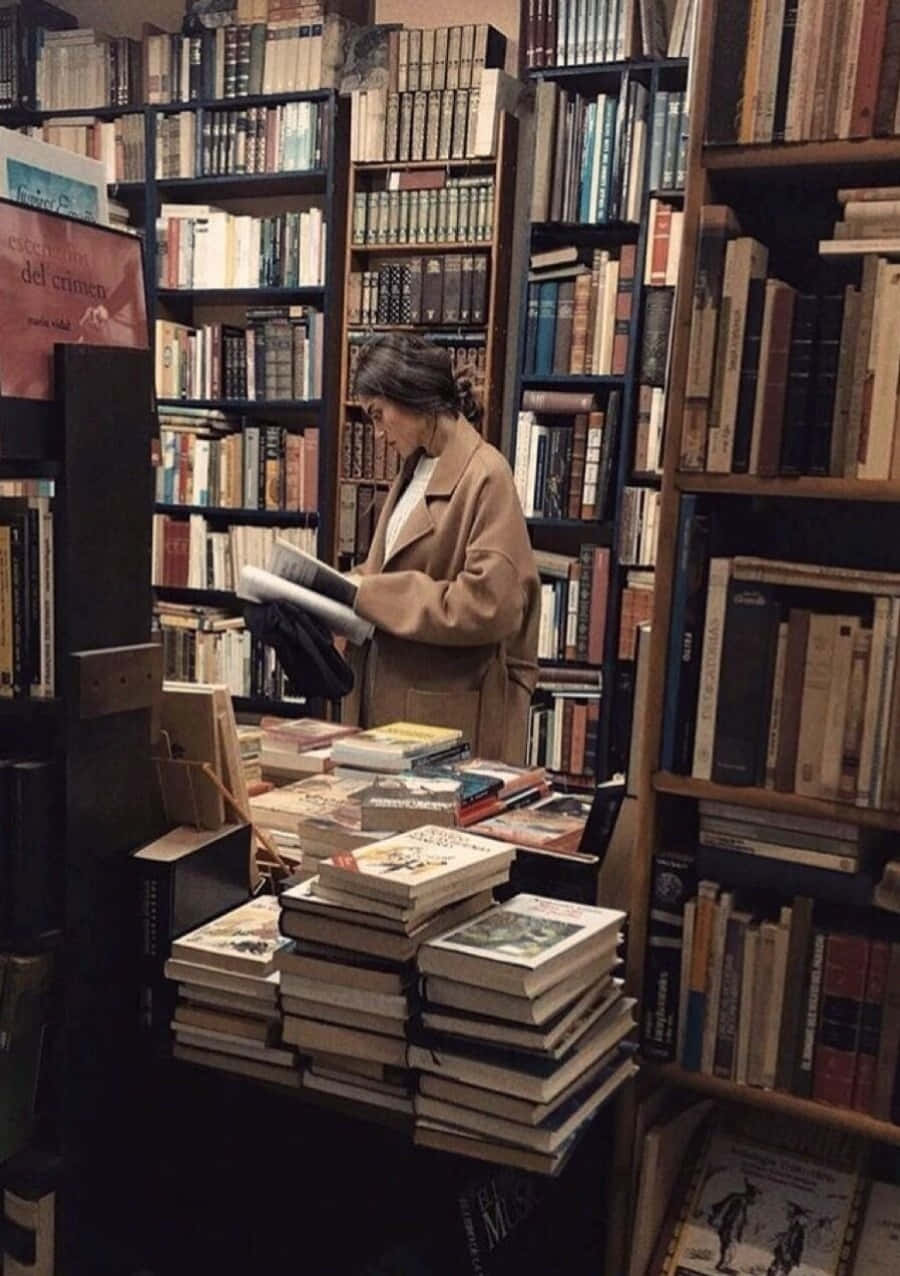 A Woman Is Reading A Book In A Bookstore