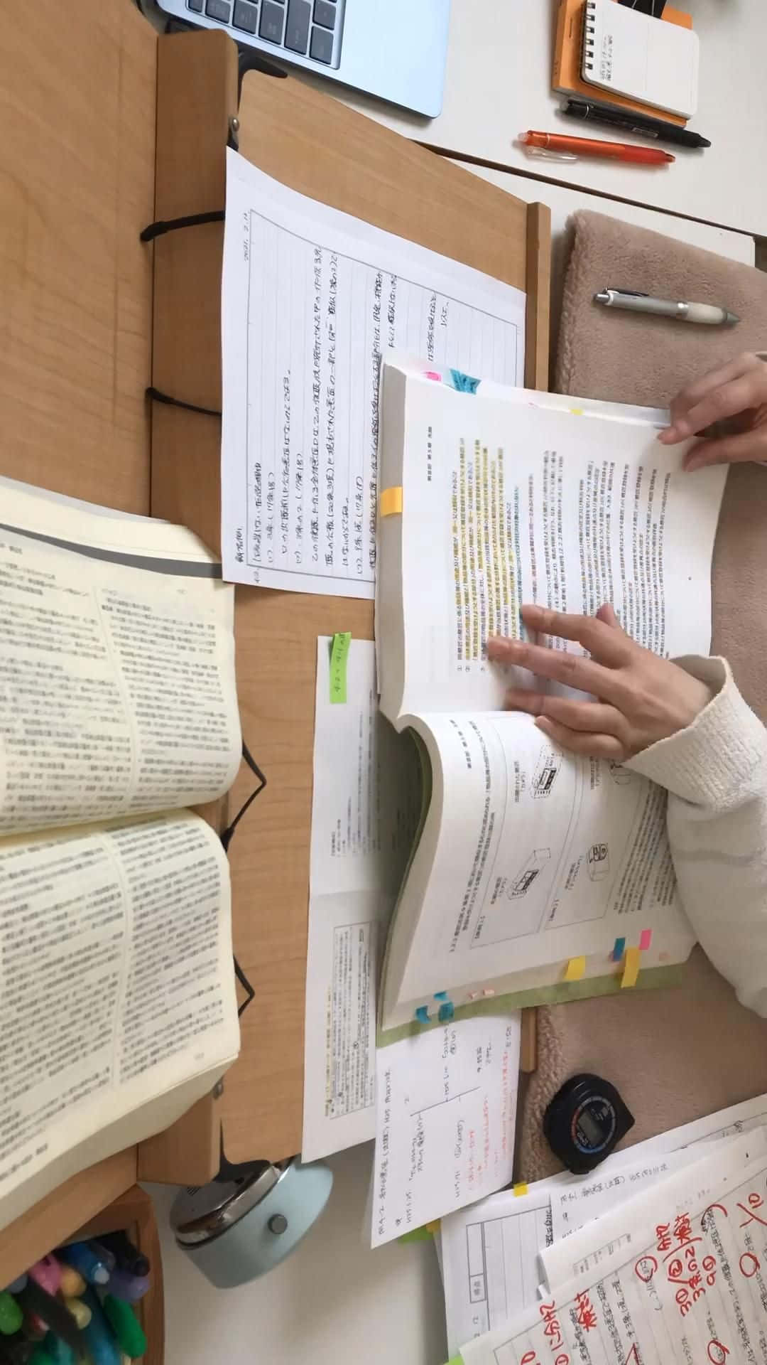 A Woman Is Reading A Book On A Desk