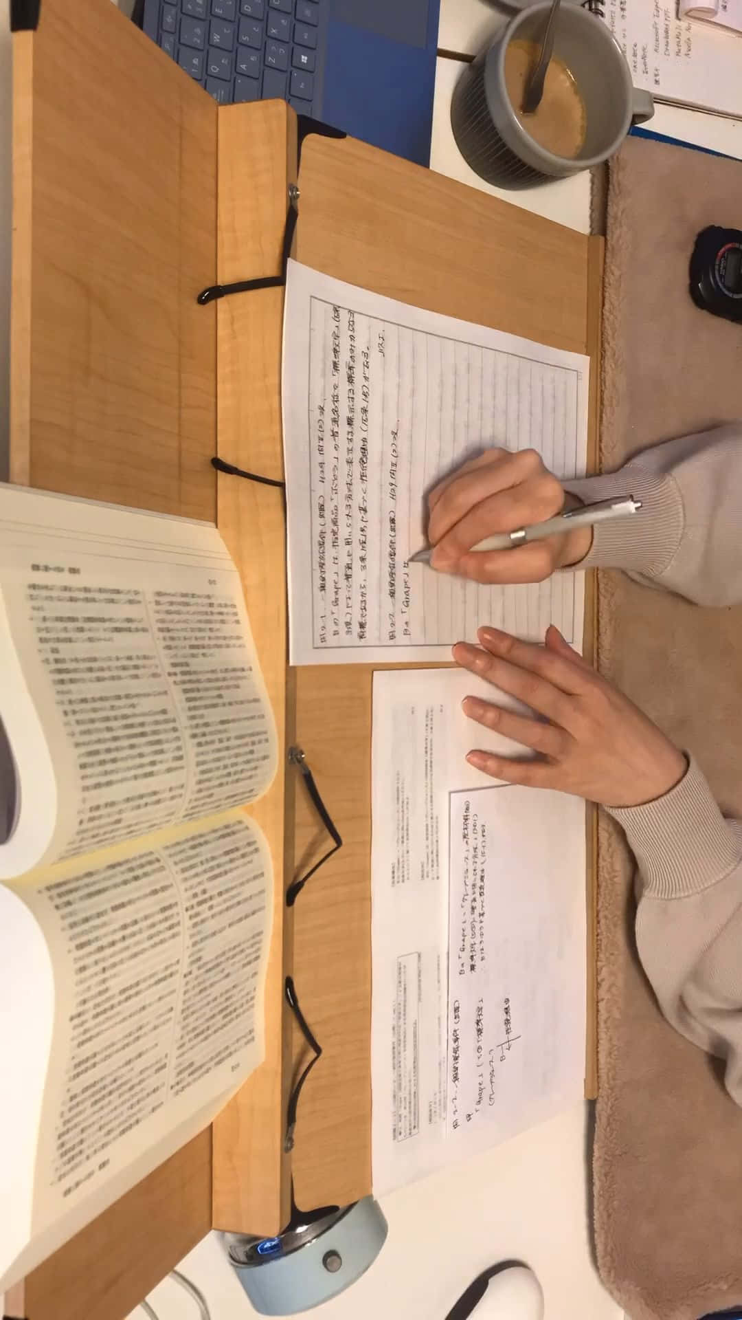 A Woman Writing In An Open Book