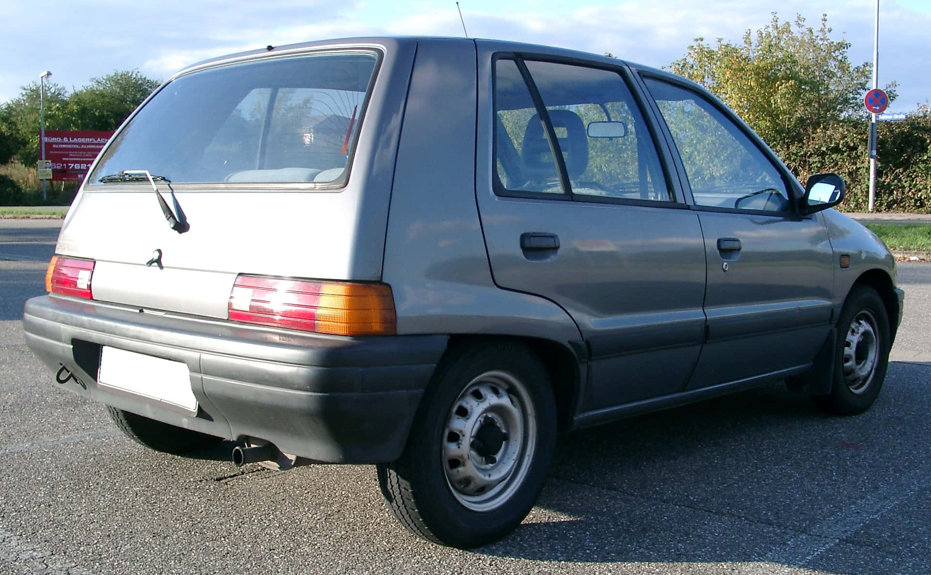 Stunning Daihatsu Charade Under The Majestic Sky Wallpaper