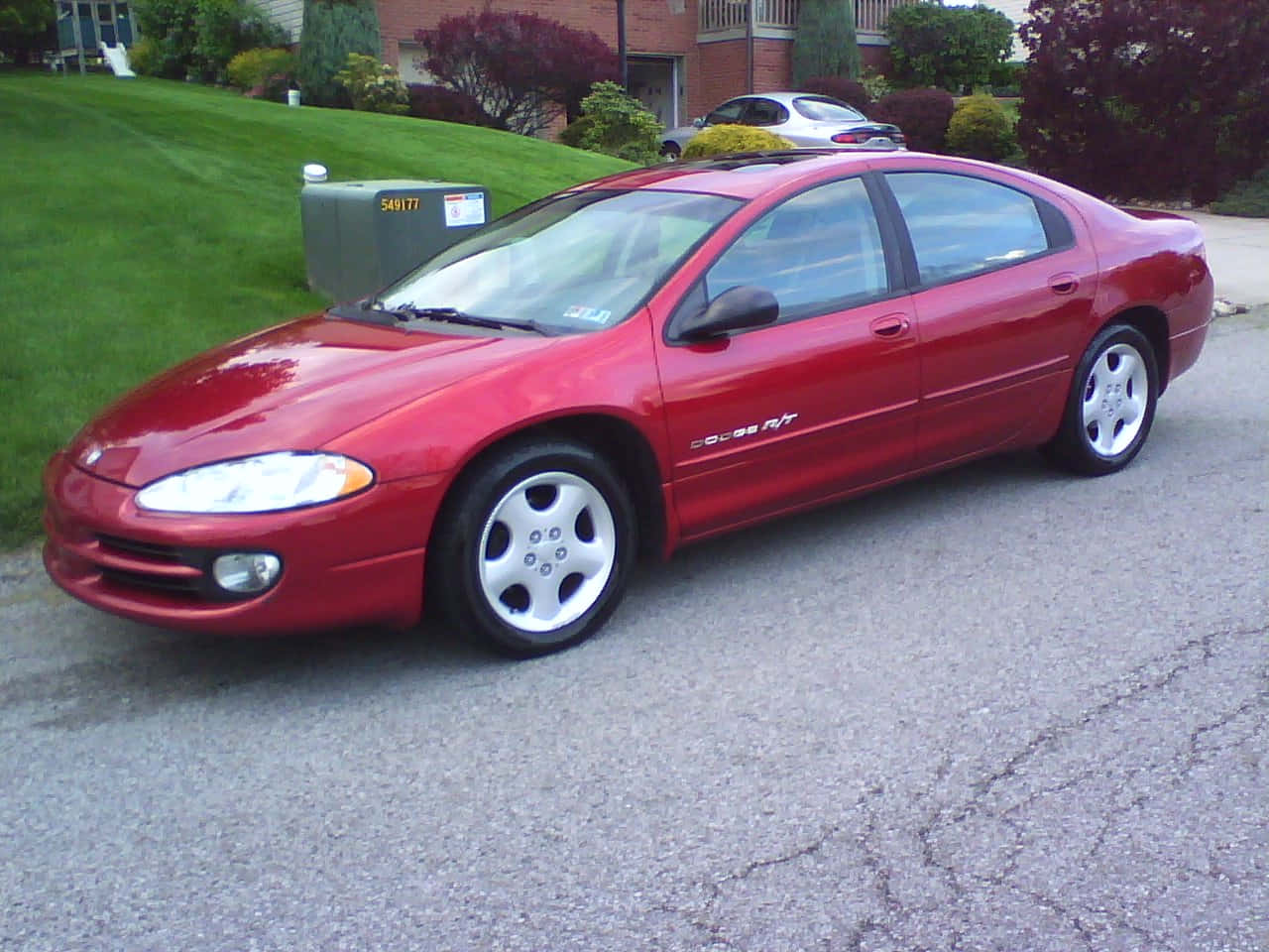 Stunning Dodge Intrepid Gliding On Open Road Wallpaper