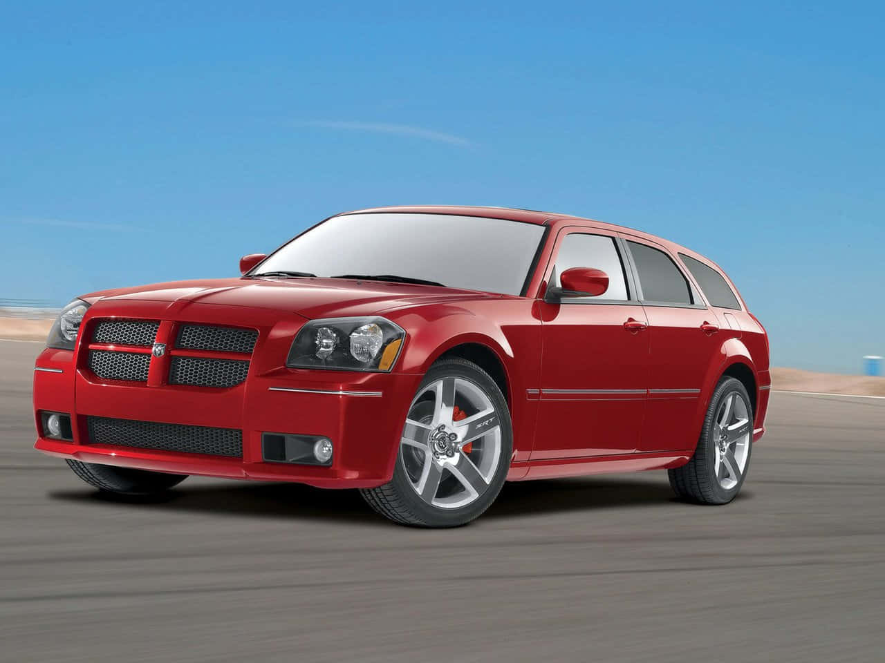 Stunning Dodge Magnum Cruising On The Highway Wallpaper