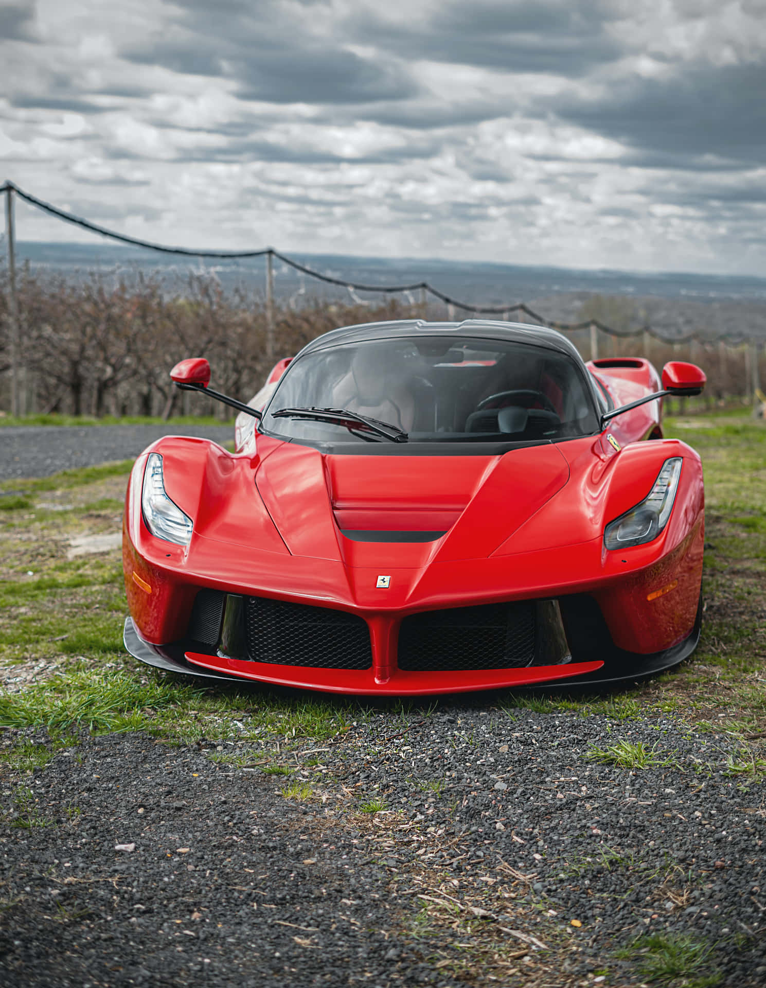 Stunning Ferrari Racing Across A Windy Road