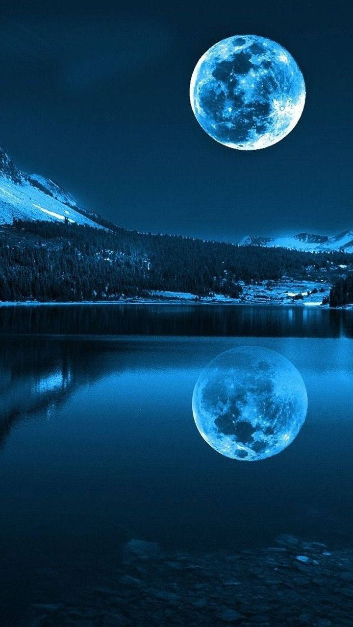 Stunning Full Moon Illuminating Around The Evening Sky Wallpaper