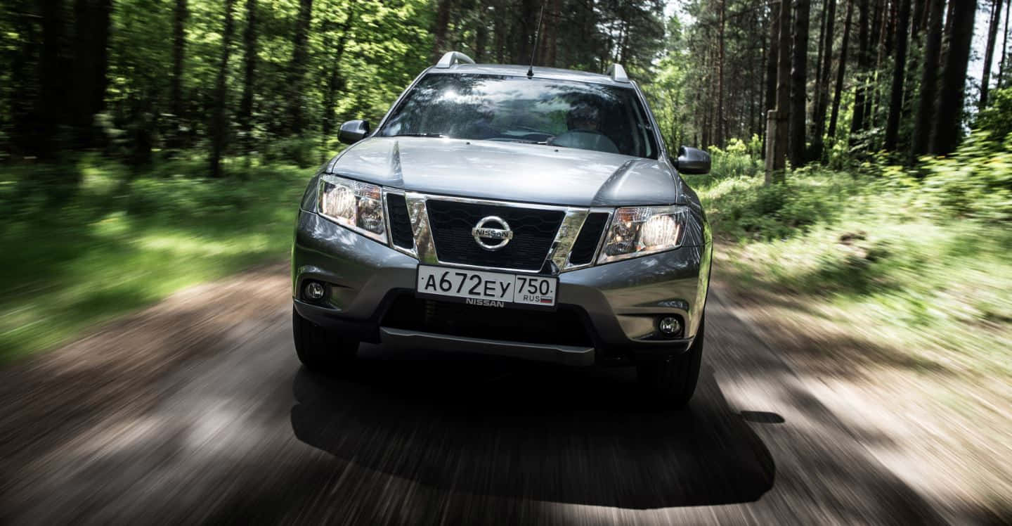 Stunning Nissan Pathfinder Cruising Outdoors Wallpaper