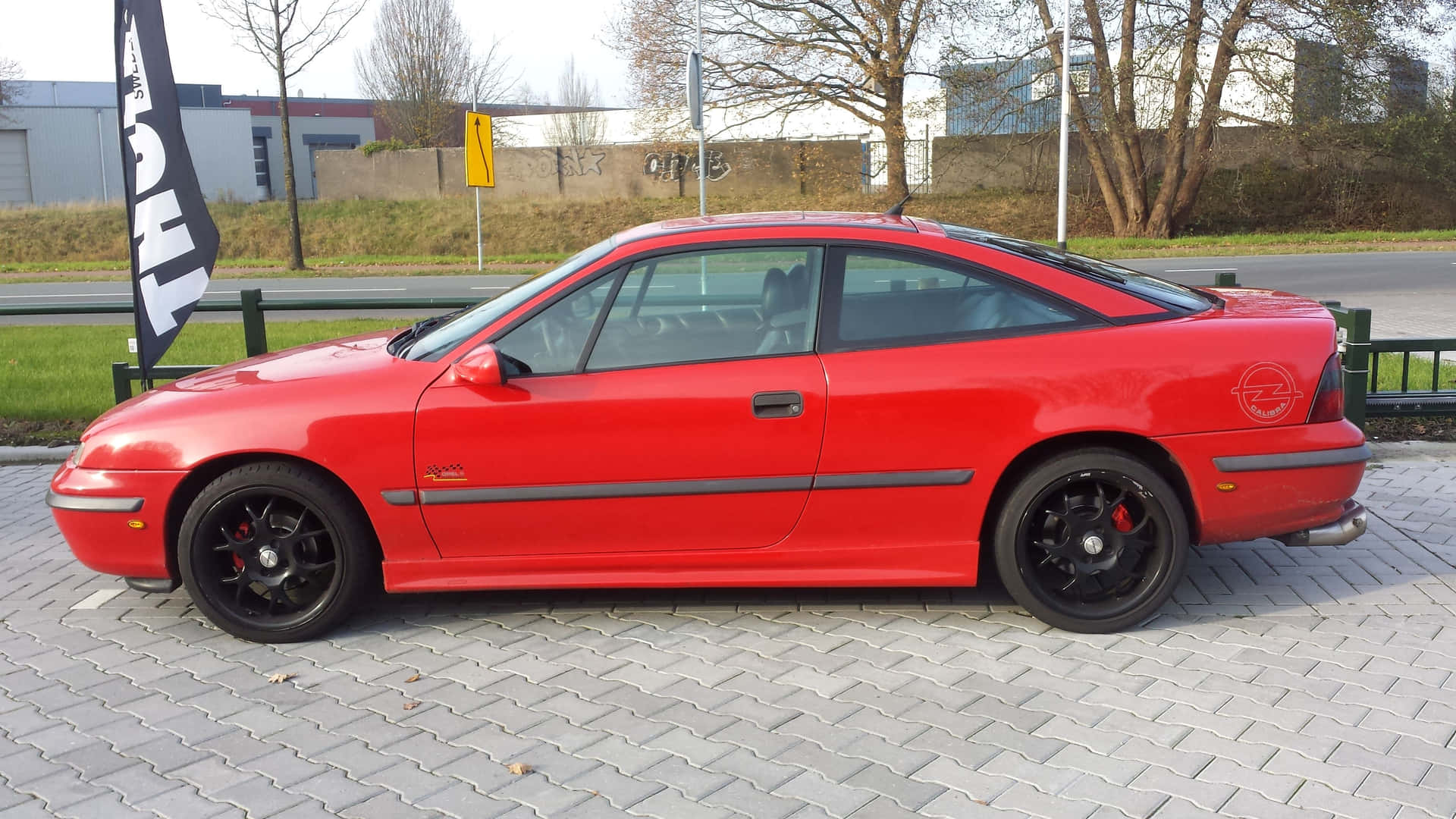 Stunning Opel Calibra Gliding On The Road Wallpaper