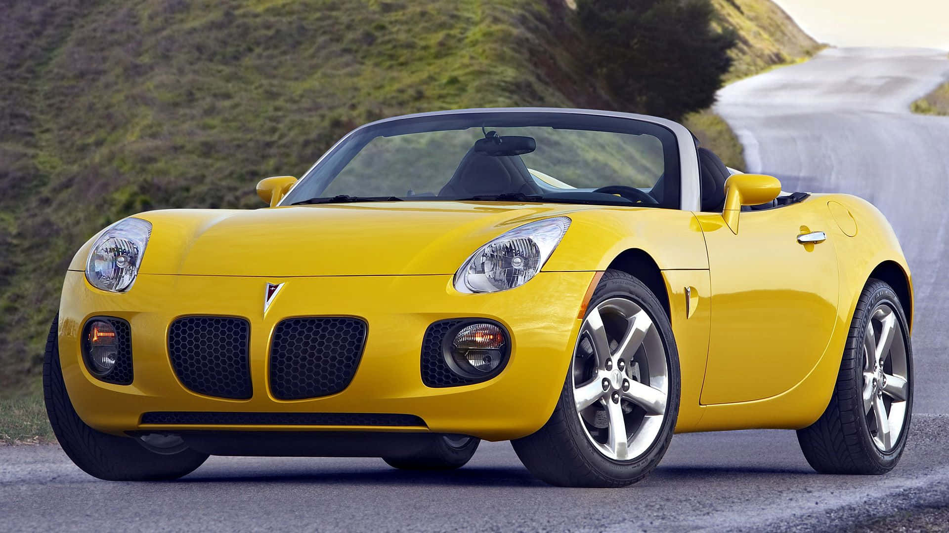 Stunning Pontiac Solstice Under The Twilight Sky Wallpaper