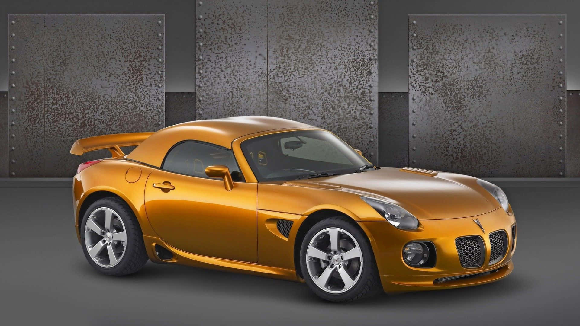 Stunning Silver Pontiac Solstice Against Skyline Wallpaper