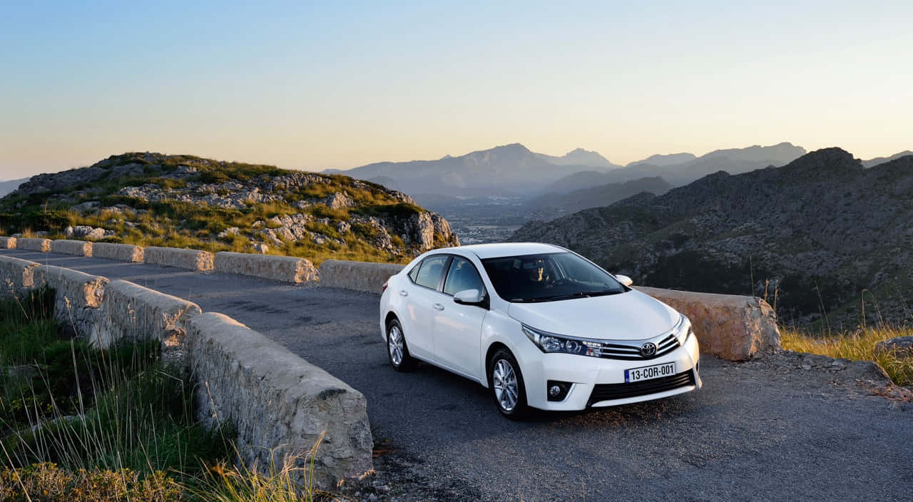 Stunning Steel Blue 2020 Toyota Corolla On A Panoramic Road Trip. Wallpaper