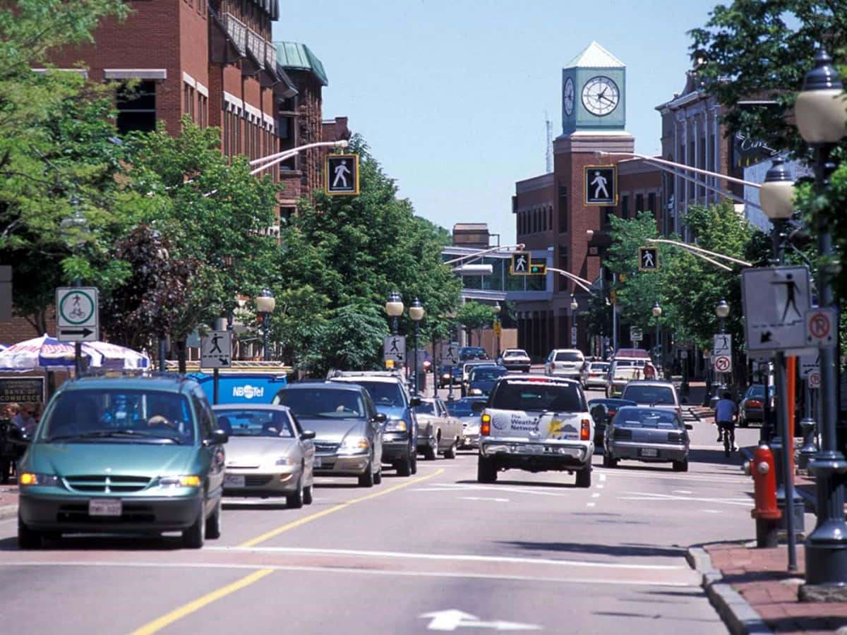 Download Stunning Sunset Over Downtown Moncton Wallpaper | Wallpapers.com