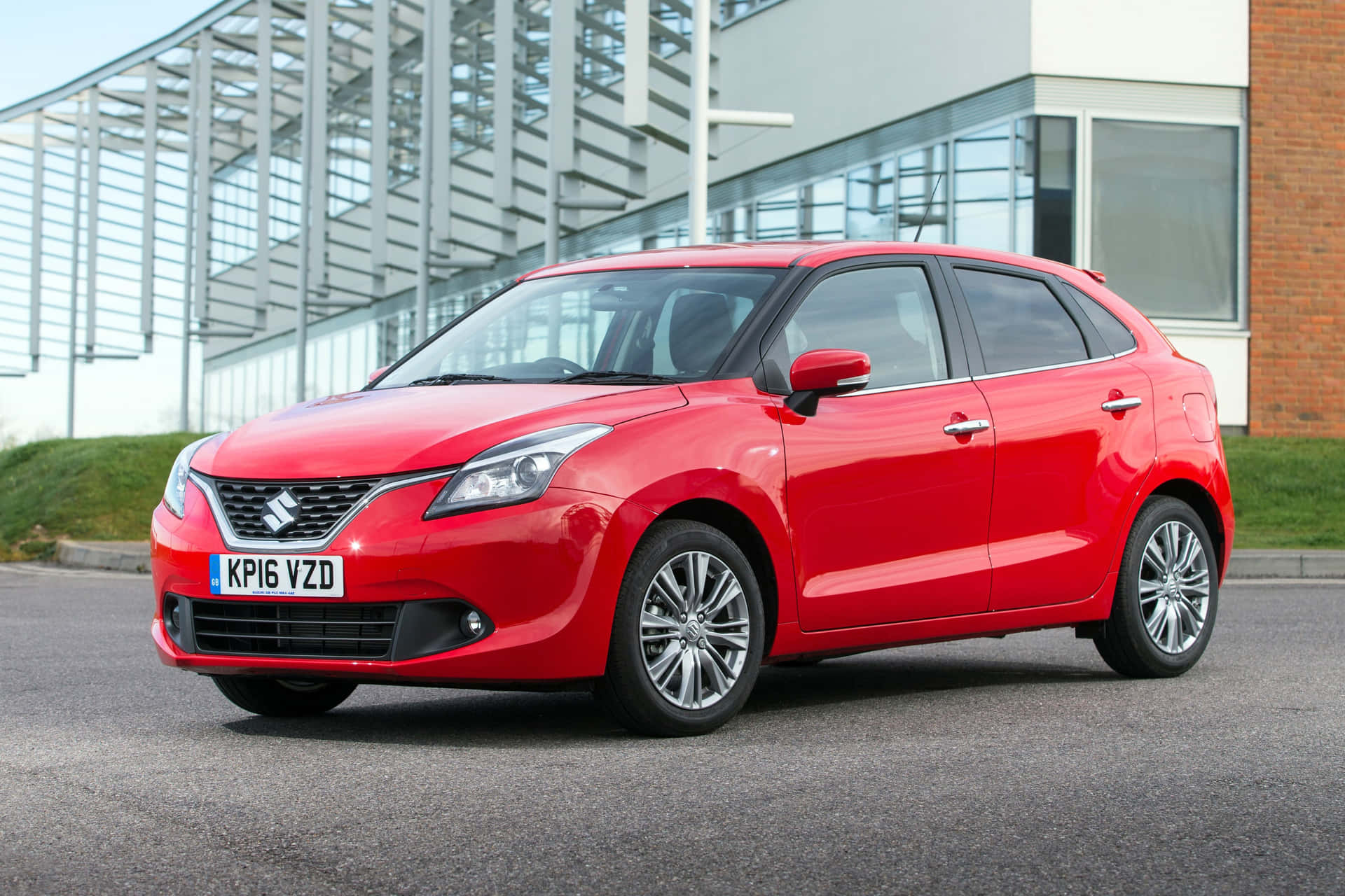 Stunning Suzuki Baleno In Vibrant Cityscape Wallpaper