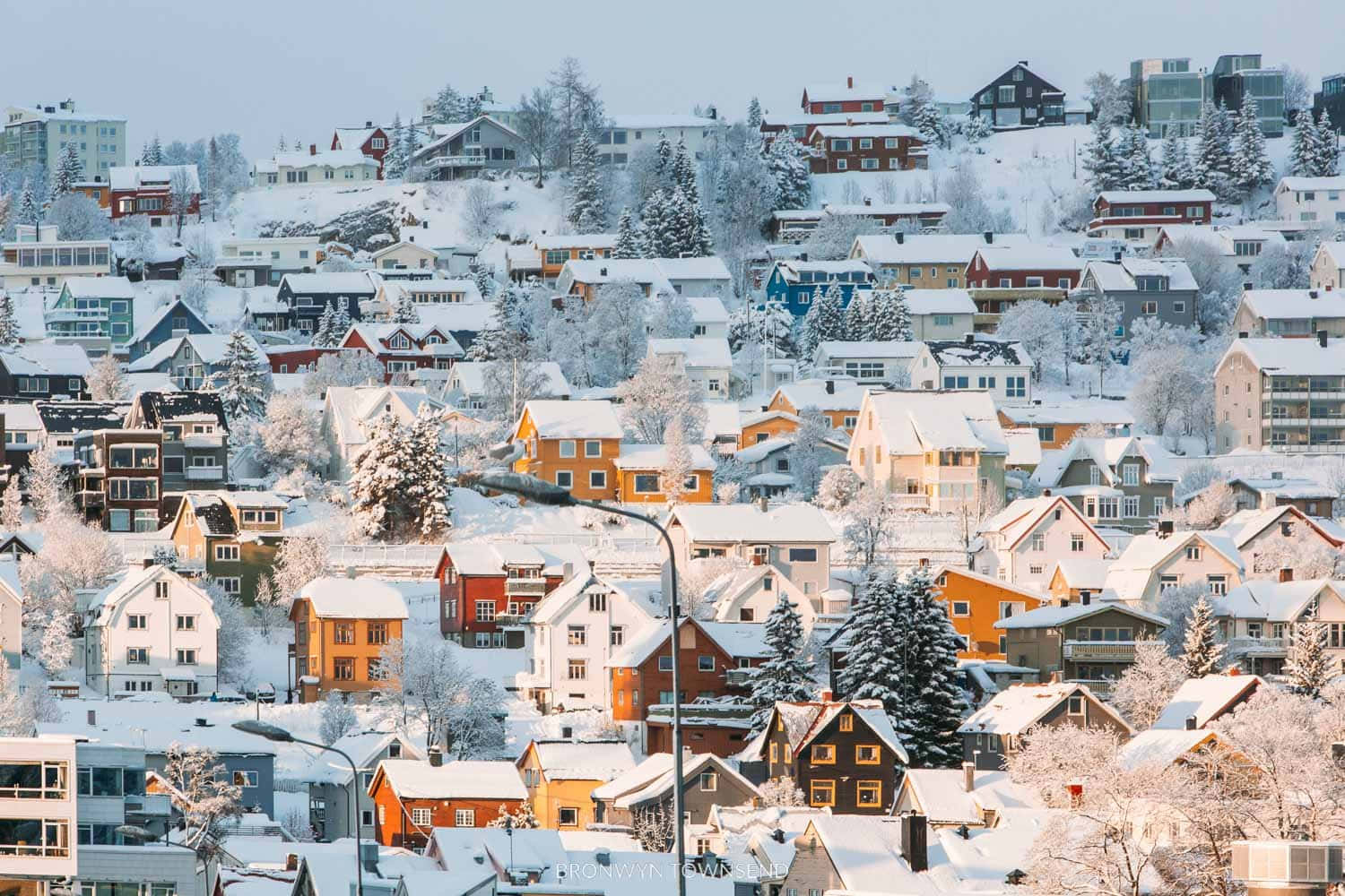 Stunning View Of Tromsø Under The Northern Lights Wallpaper