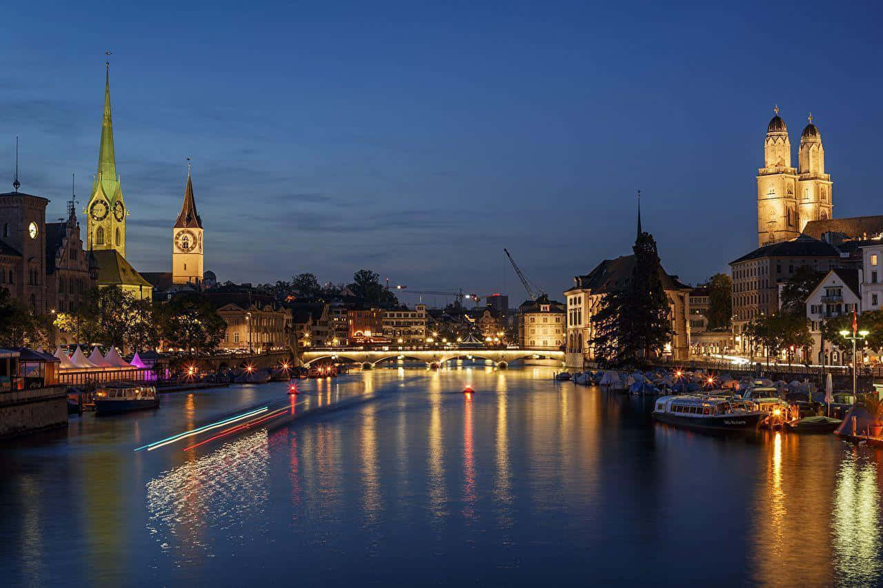 Stunning View Of Zurich Cityscape At Twilight Wallpaper