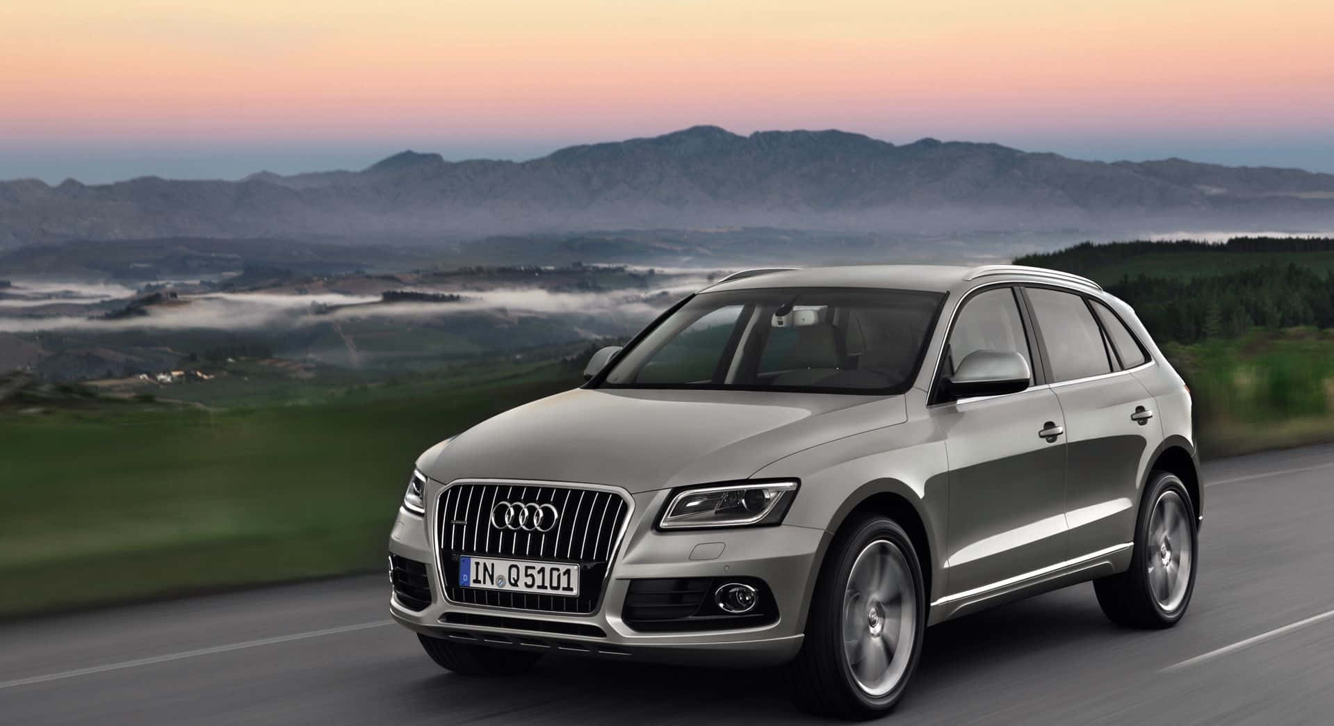 Stylish And Luxurious Audi Q5 In Vibrant Cityscape Wallpaper