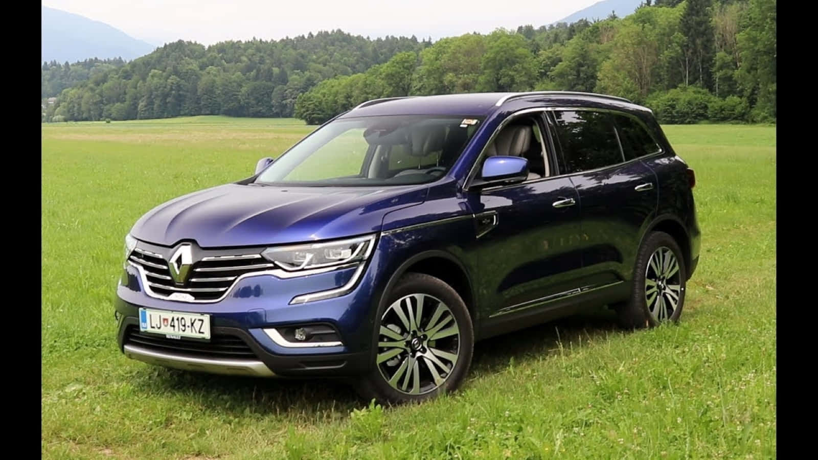 Stylish And Luxurious Renault Koleos On The Road Wallpaper