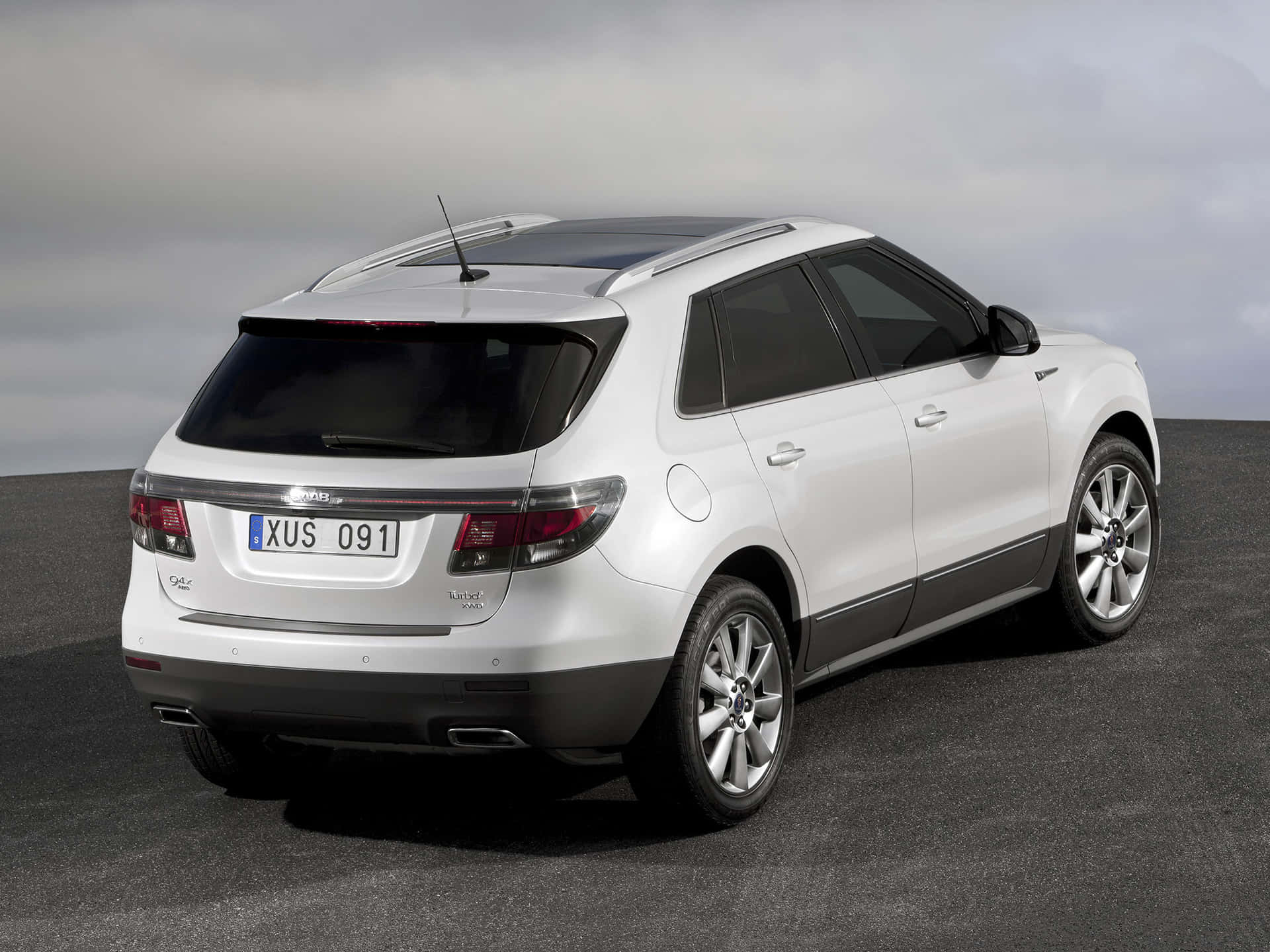 Stylish And Luxurious Saab 9-4x Suv On An Open Road Wallpaper