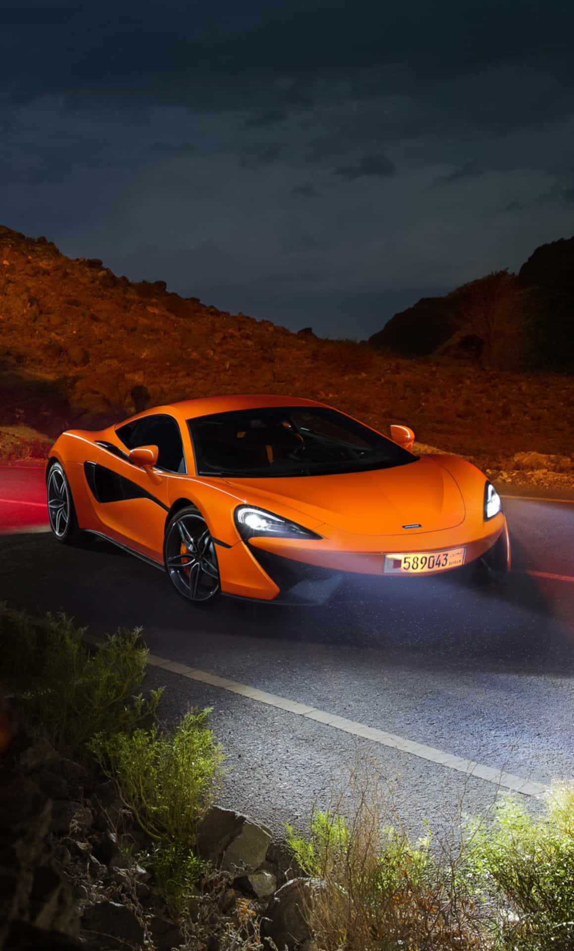 Stylish And Powerful Mclaren 540c In Vibrant Scenario Wallpaper