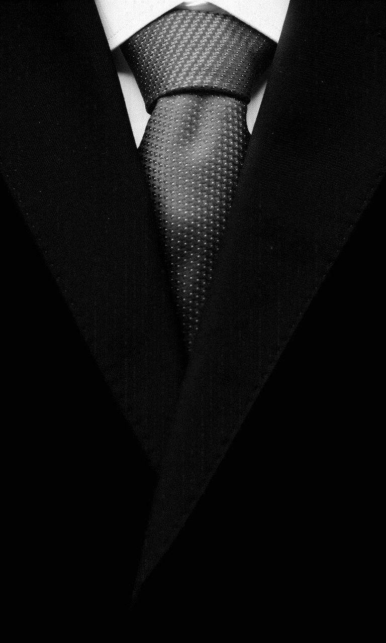 Stilfuld sort frakke og slips Design- Wallpaper Wallpaper