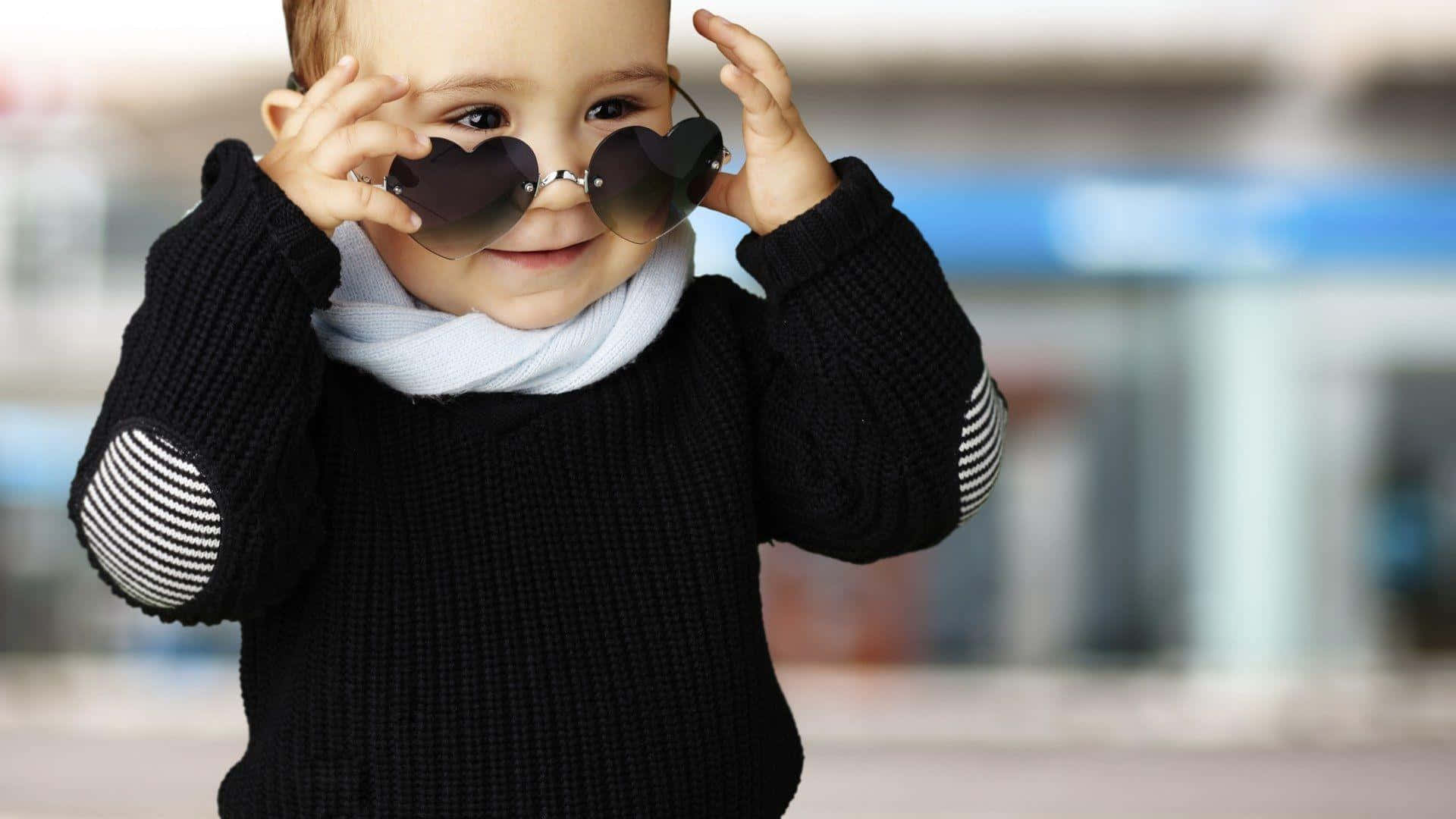 Stylish Boy Wearing Heart Sunglasses Wallpaper
