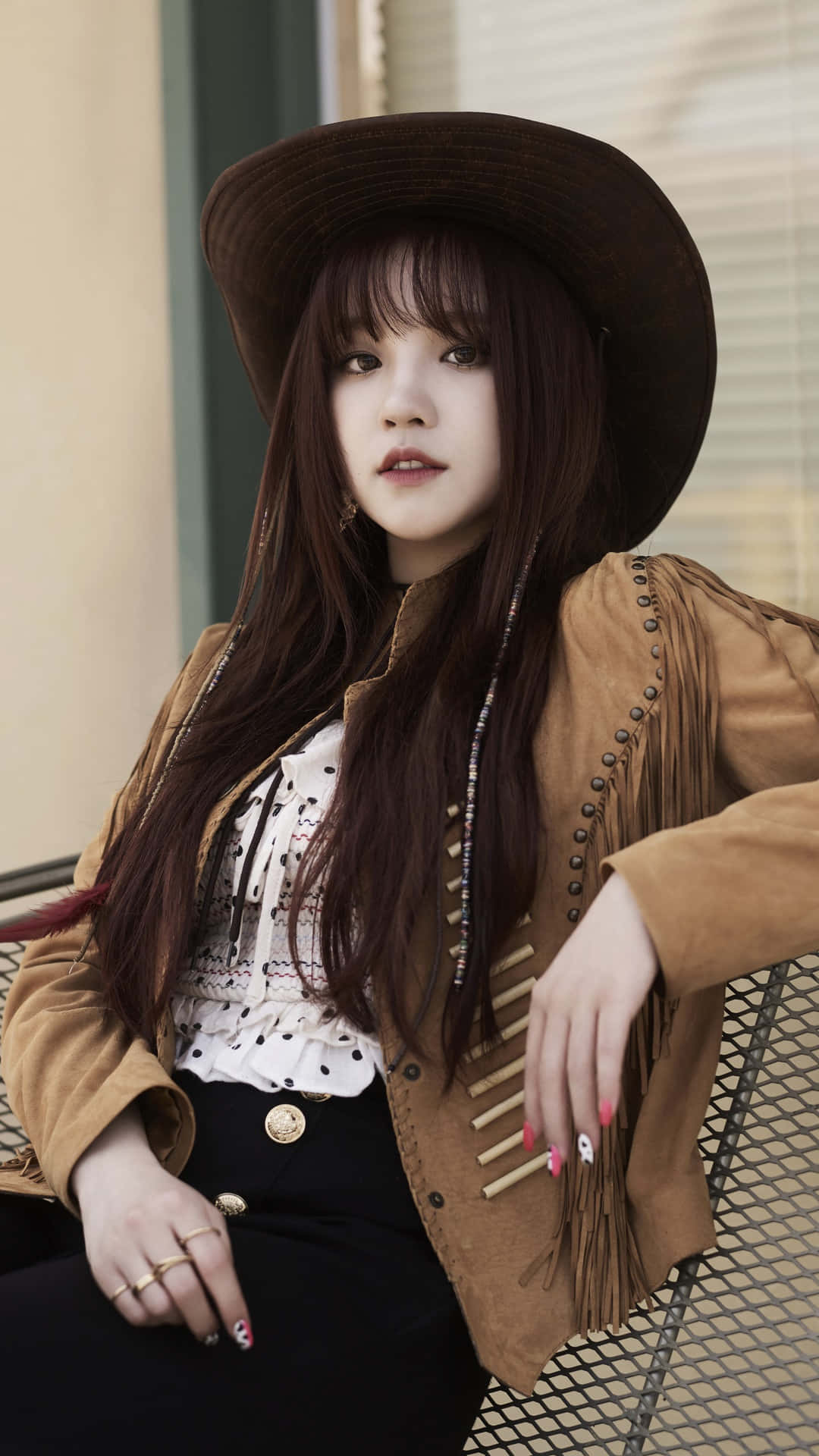 Stylish Cowgirl Outfit Portrait Wallpaper