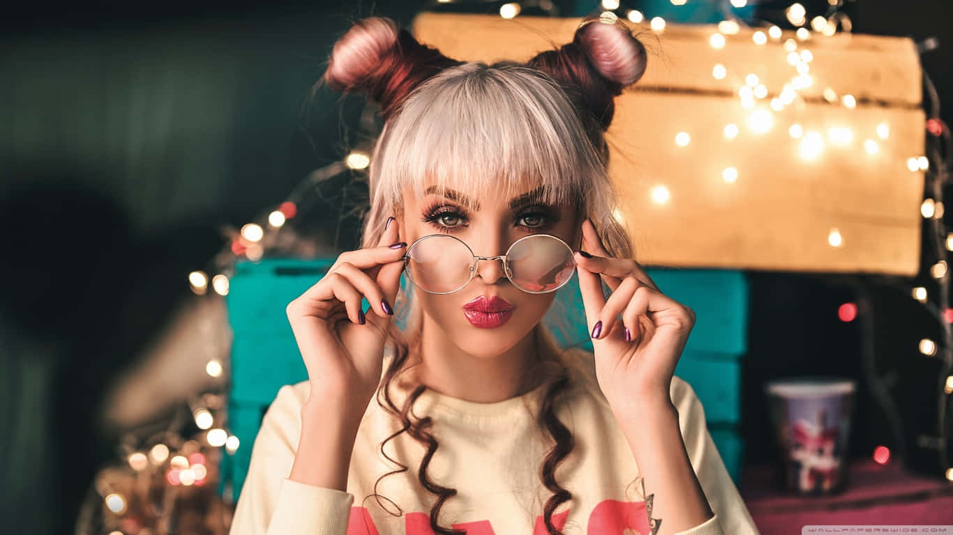 Stylish Girlwith Glassesand Two Buns Hairstyle Wallpaper