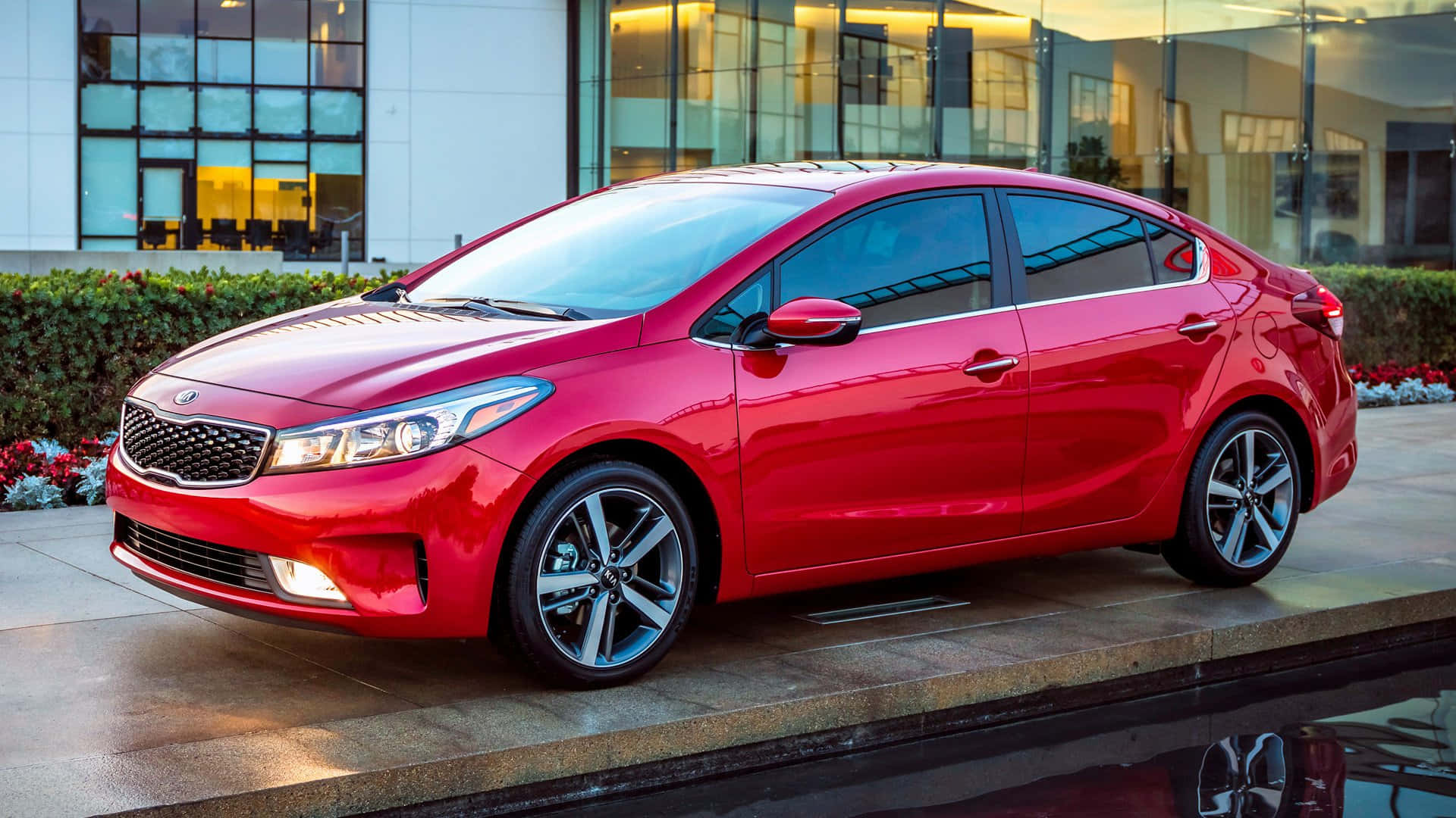 Stylish Kia Forte In Urban Landscape Wallpaper