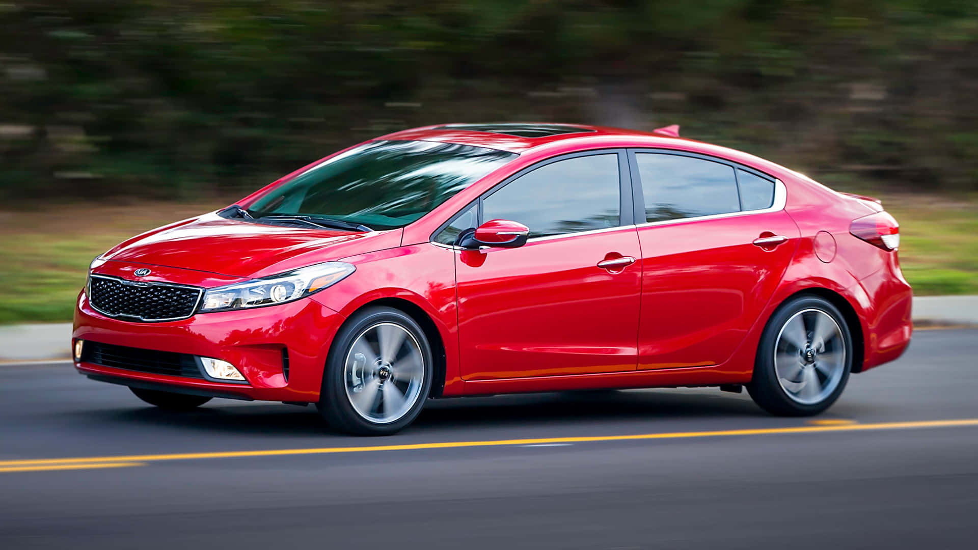 Download Stylish Kia Forte On The Road Wallpaper | Wallpapers.com