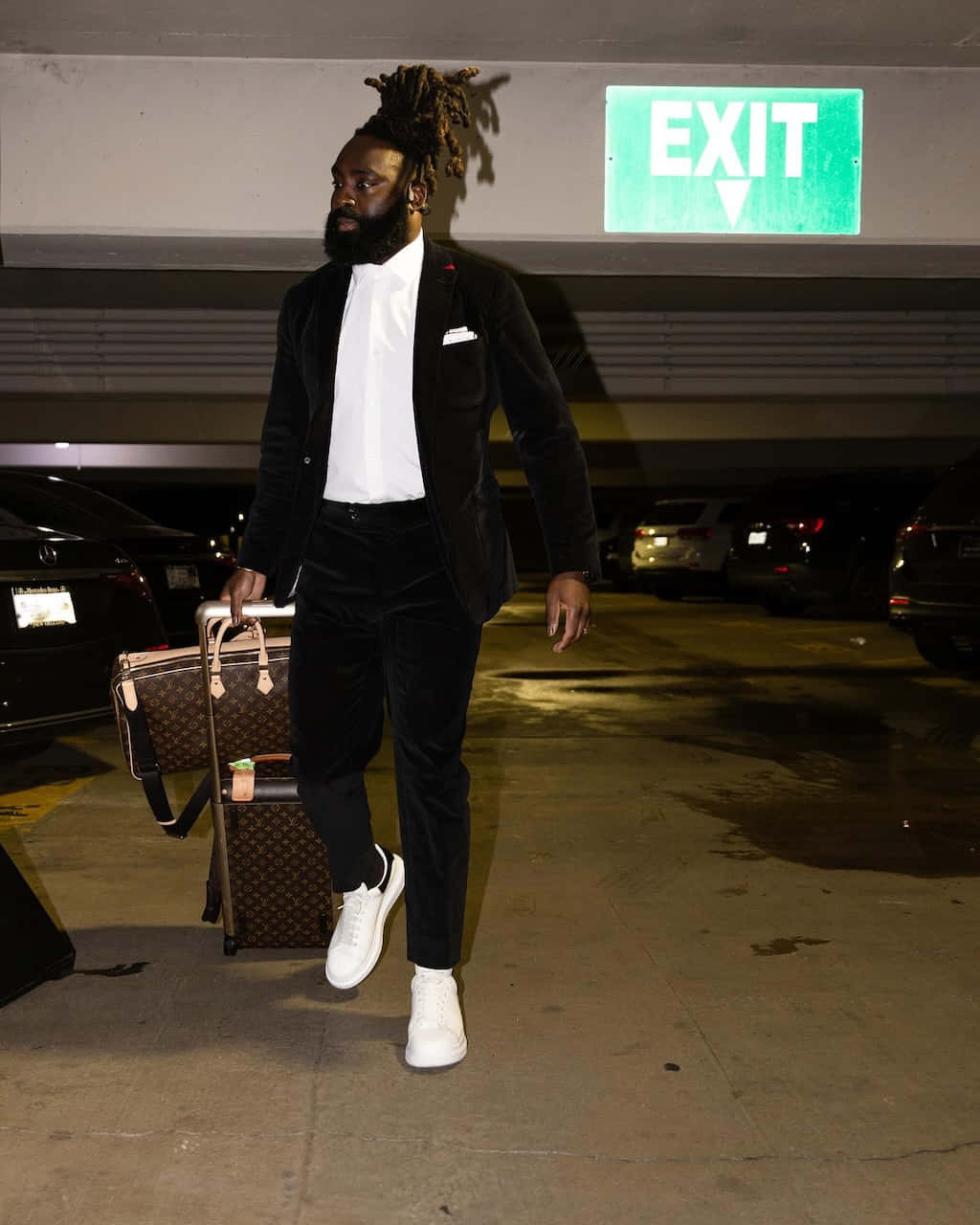 Stylish Man Exiting Parking Garage Wallpaper