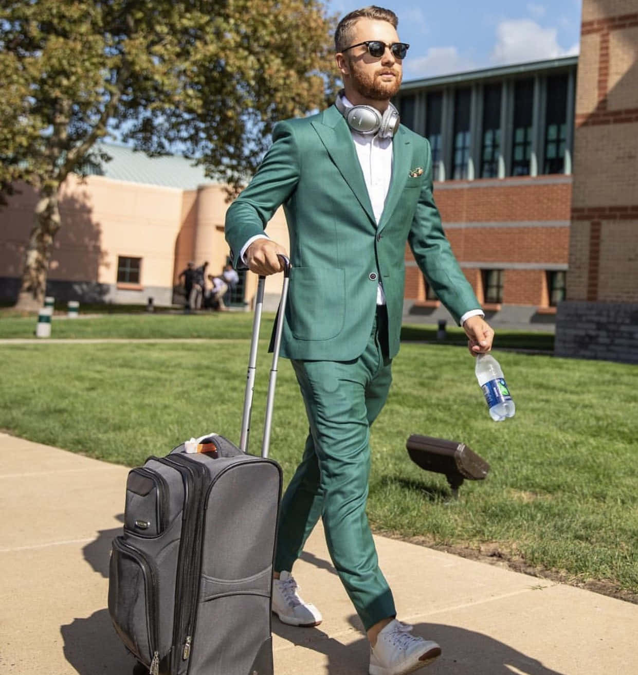 Stylish Man Walking With Suitcase Wallpaper