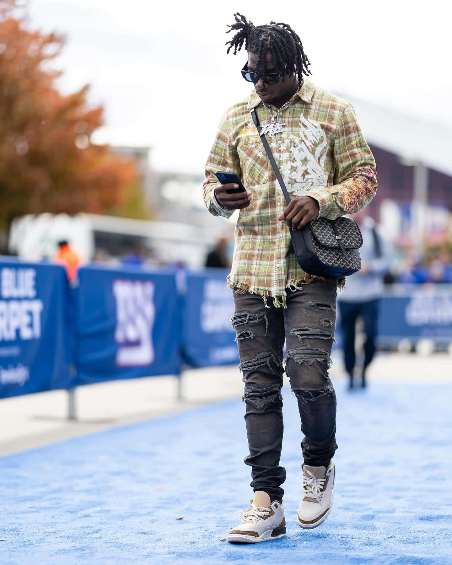 Stylish Man Walkingon Blue Carpet Wallpaper