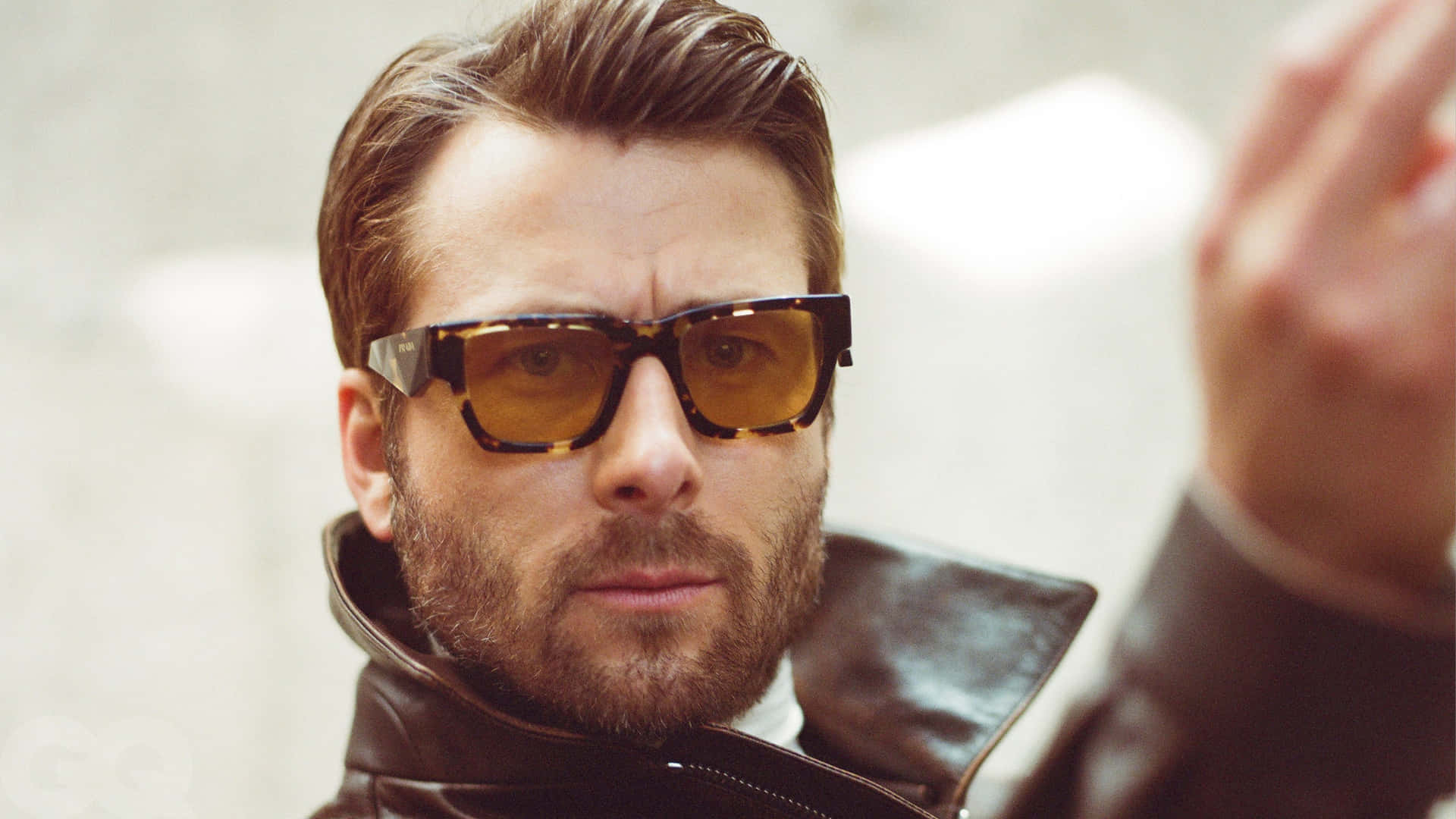 Stylish Manin Leather Jacketand Sunglasses Wallpaper